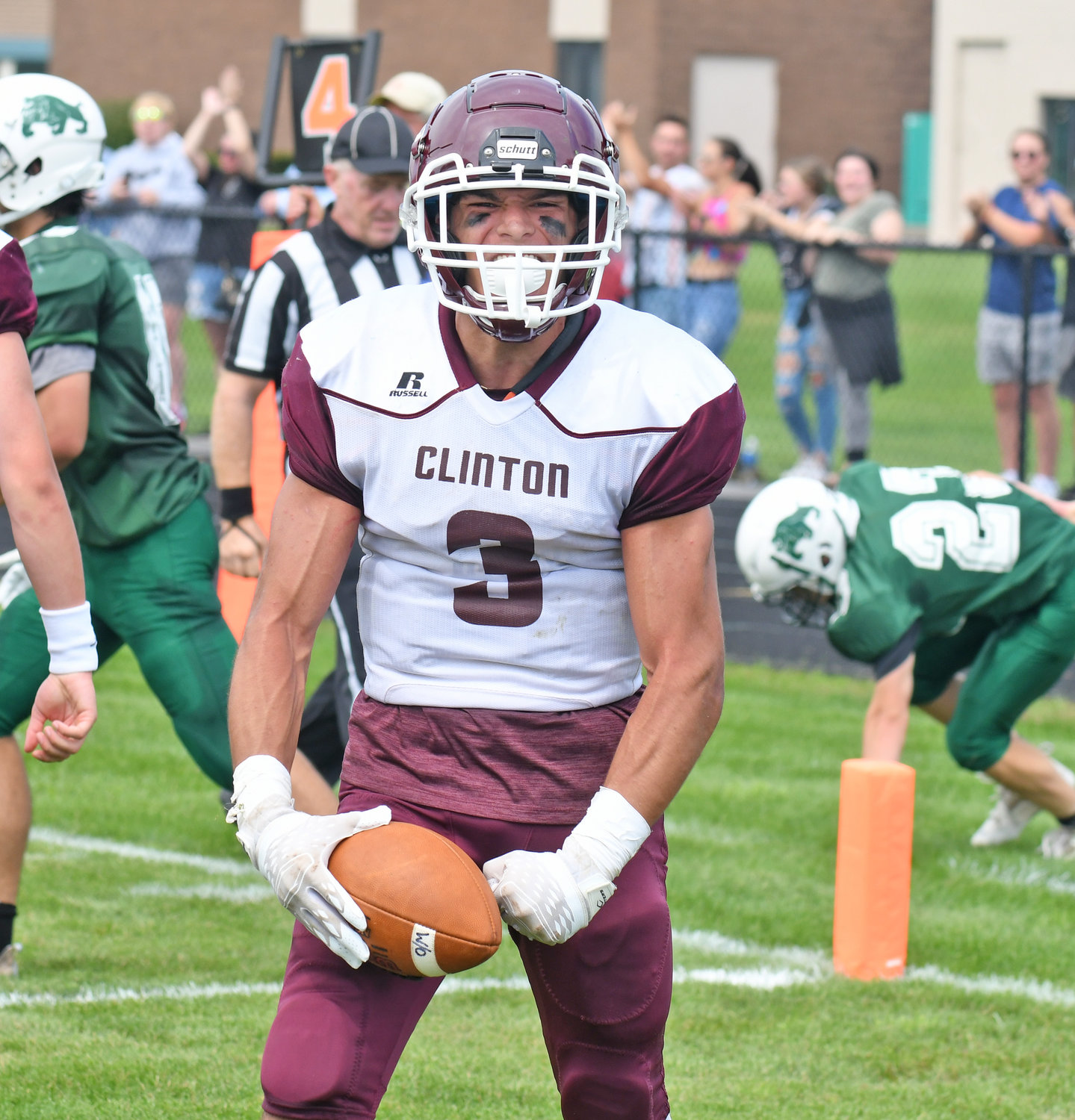 Clinton senior Cameron Maline expresses himself after scoring a touchdown on a punt return in the second quarter during Saturday afternoon's non-league game against host Westmoreland/Oriskany. The Warriors won 28-6.