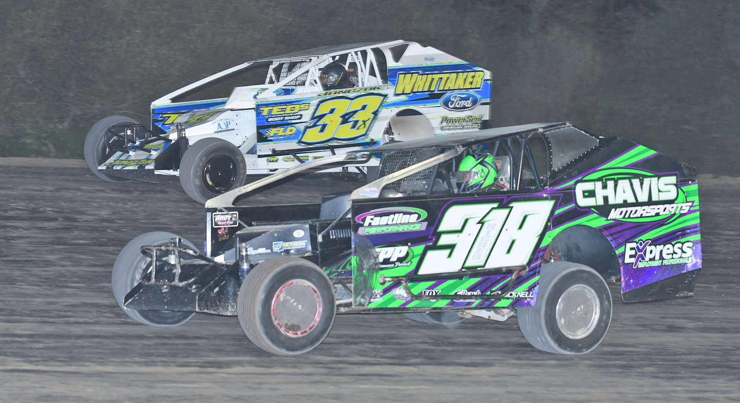 Durhamville's Matt Janczuk, in the no. 33xm uses the high side of turn four to pass Dave Richer on his way to winning the 25-lap sportsman New Yorker feature Sunday night and in doing so Jancauk won his 12th feature race at Utica-Rome Speedway in 2022.