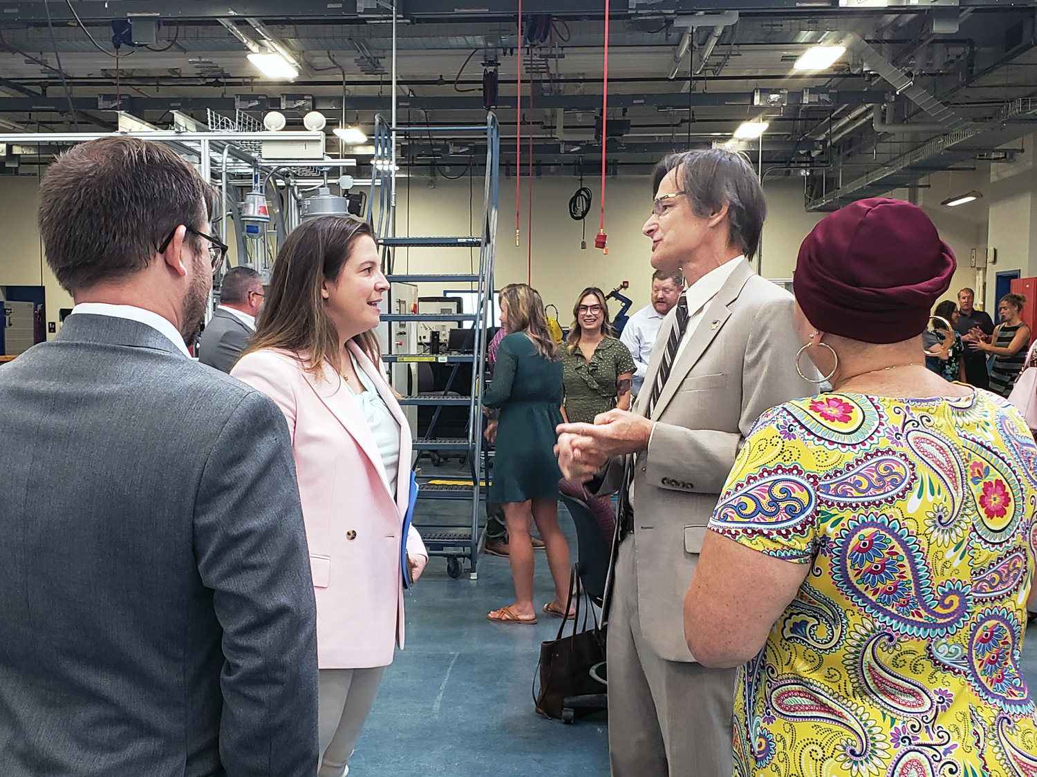 Congresswoman Elise Stefanik (left) and Clinton Community College President John Kowal speak in CCC's Institute for Advanced Manufacturing ahead of an event launching a new scholarship program.