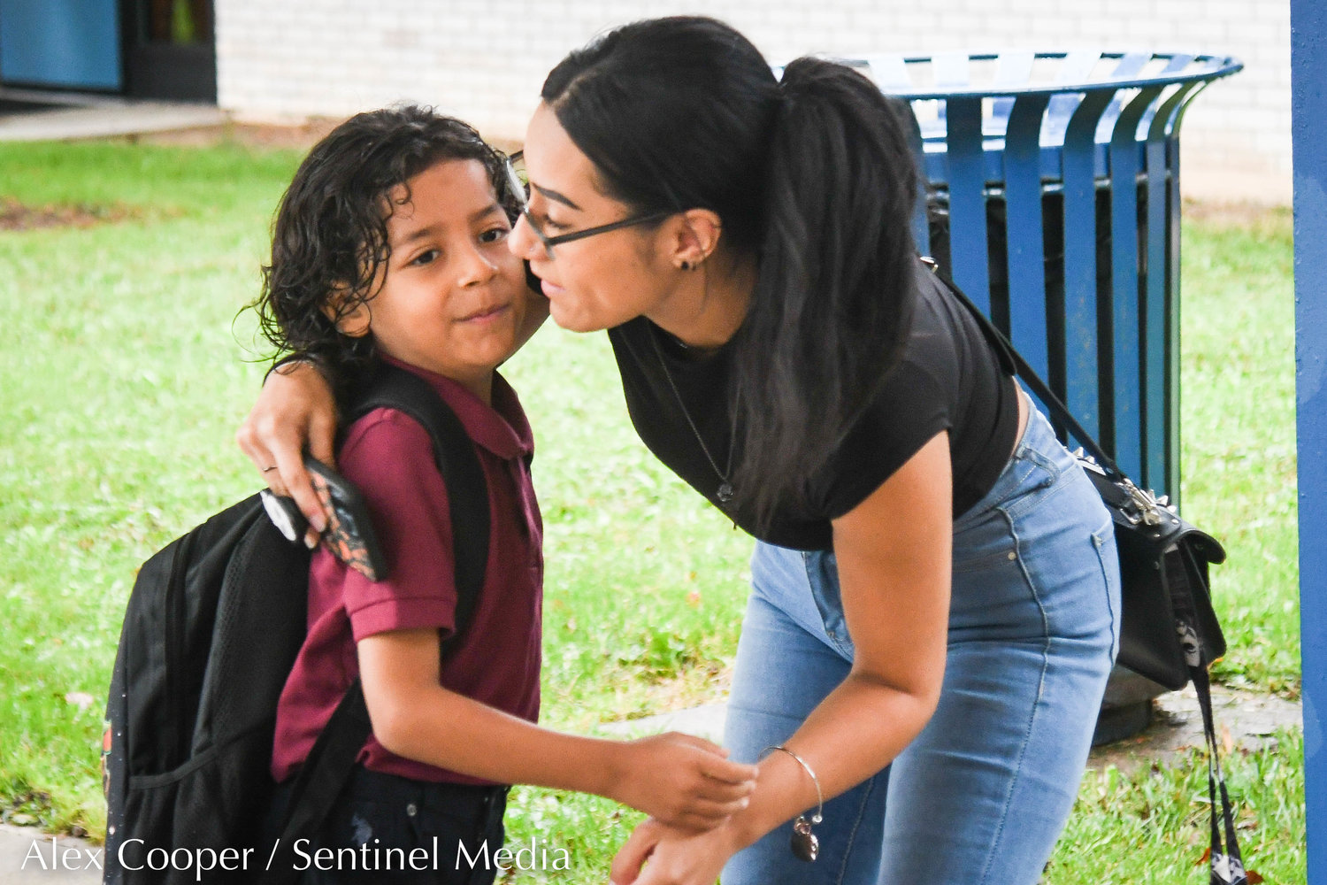 Gabriella Mendez hugs her son Gabriel during the first day back to school at Utica Academy of Science Elementary School on Tuesday in Frankfort.