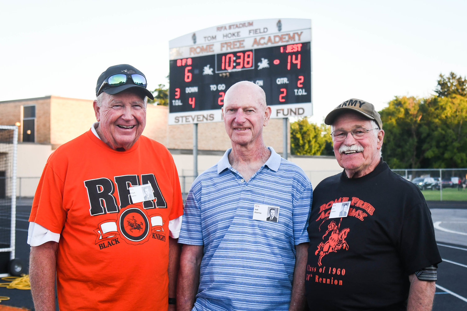 Three members of the 1959 undefeated Rome Free Academy football team were honored after the first quarter of the non-league game between New Hartford and Rome Free Academy on Friday night at RFA Stadium. They are, from left, Mick Carrier, Jack Charney and John Gordon.