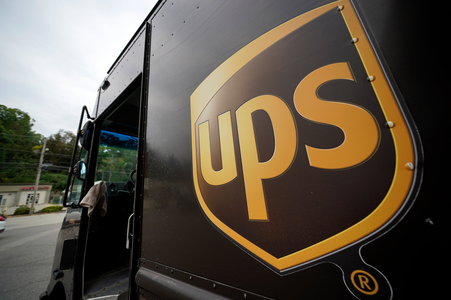 This is the UPS logo on the side of a delivery truck in Mount Lebanon, Pa., on Tuesday, Sept. 21, 2021. United Parcel Service said Wednesday, Sept 7, 2022, it plans to hire more than 100,000 extra workers to help handle an increase in packages during the critical holiday season. That‚Äôs similar to the holiday seasons of 2021 and 2020. (AP Photo/Gene J. Puskar)