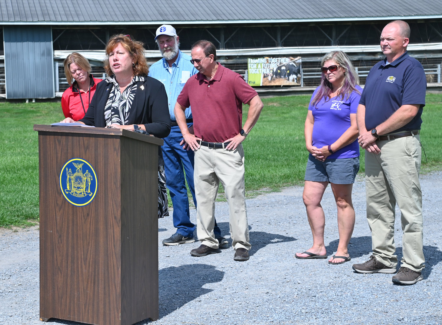 Assemblywoman Marianne Buttenschon, D-119, Marcy, state Sen. Joseph A. Griffo, R-47, Rome, are joined by several local farmers during a press conference discussing a proposed reduction in the farmworker overtime threshold during a press conference on Thursday at DiNitto’s Farm on Benton Road in Marcy on Thursday.