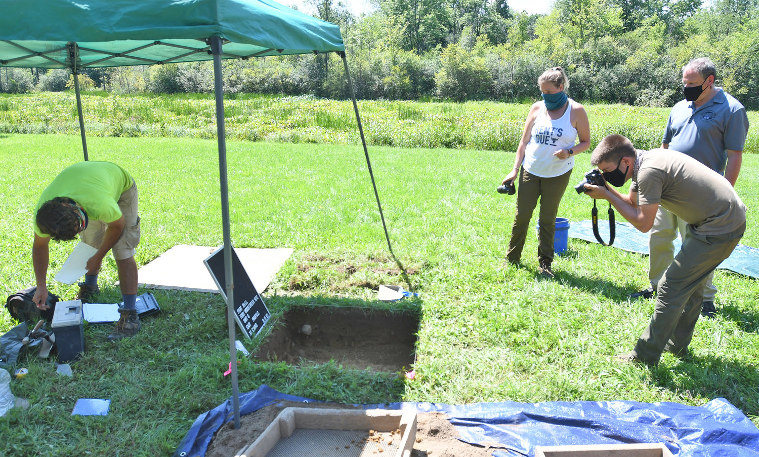 Fort Bull dig left to right Paul Brown- field tech, Laura Klingman- grad student at Binghamton, Josh Anderson- crew chief for public Archaeology Facility  and Art Simmons from Rome Historical Society. Anderson is documenting/photographying the soil at the Fort Bull dig.