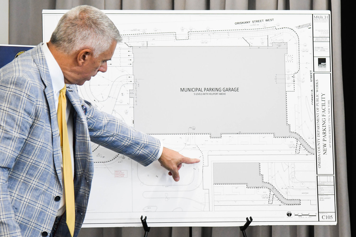 County Executive Anthony J. Picente Jr. shows the renderings and site plans for the county’s parking garage that will adjoin the new Wynn Hospital in downtown Utica on Thursday.