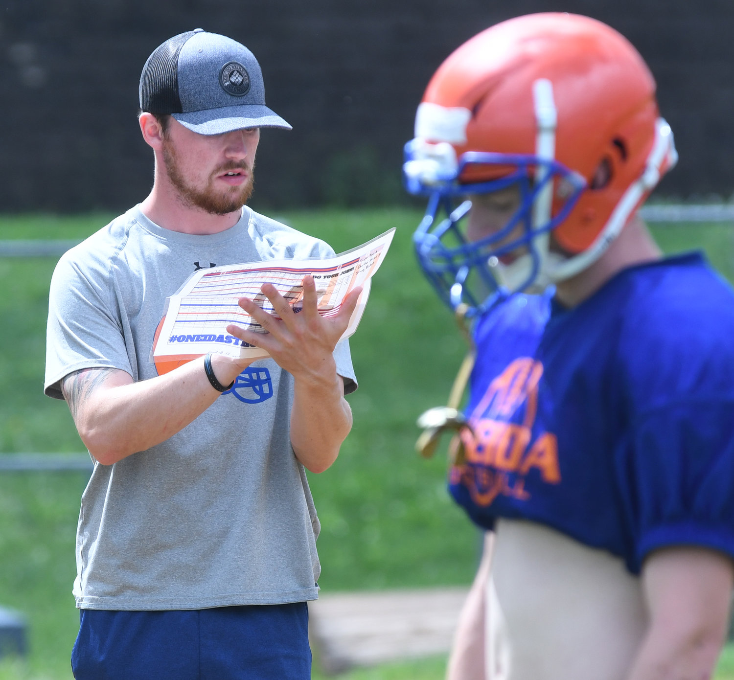 Oneida first-year head coach Matt McCoy reads off a card during preseason practice. The former Vernon-Verona-Sherrill player was a defensive back at then-Utica College and later coached on the defensive staff there. Now he’s trying to lead the Oneida team back from being 2-3 in the spring 2020-21 season and 3-5 last fall.