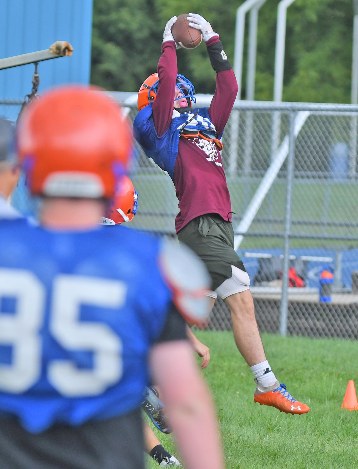 Oneida senior wide receiver Hayden Freebern jumps to make a catch during a preseason practice. He's back on the field after missing some time last year with an injury.