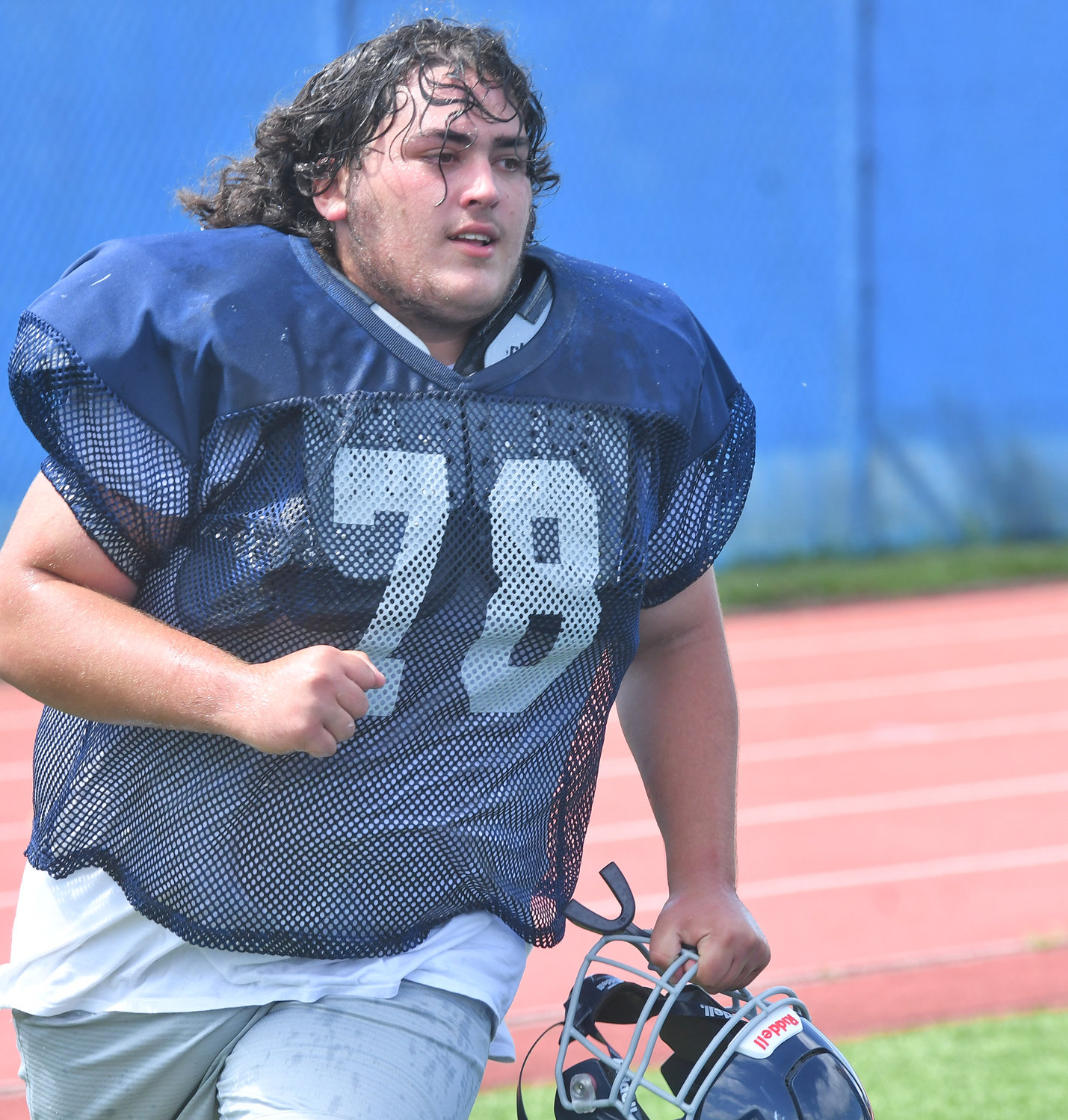 Whitesboro lineman Cameron Iona hustles out to the field after a water break during a practice at Edwin Wadas Athletic Complex.