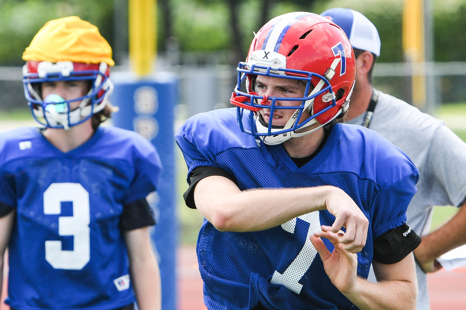 New Hartford quarterback Dominic Ambrose makes a throw during a recent practice. Ambrose was the starting quarterback last season.