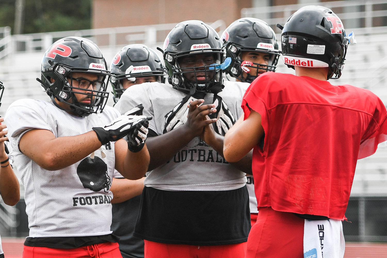 Proctor players break a huddle during practice on Aug. 30 after a play is called by senior quarterback Todd Abraham, who is set to be the team’s starter this season.