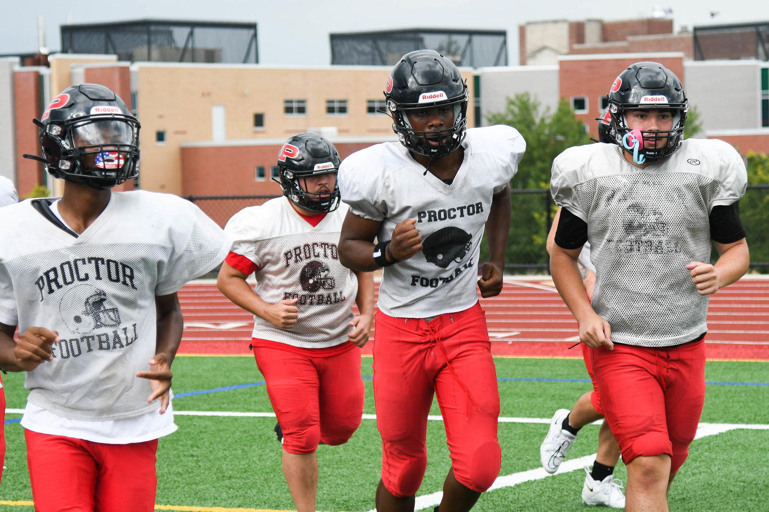 Proctor players switch stations during conditioning drills in an Aug. 30 practice.