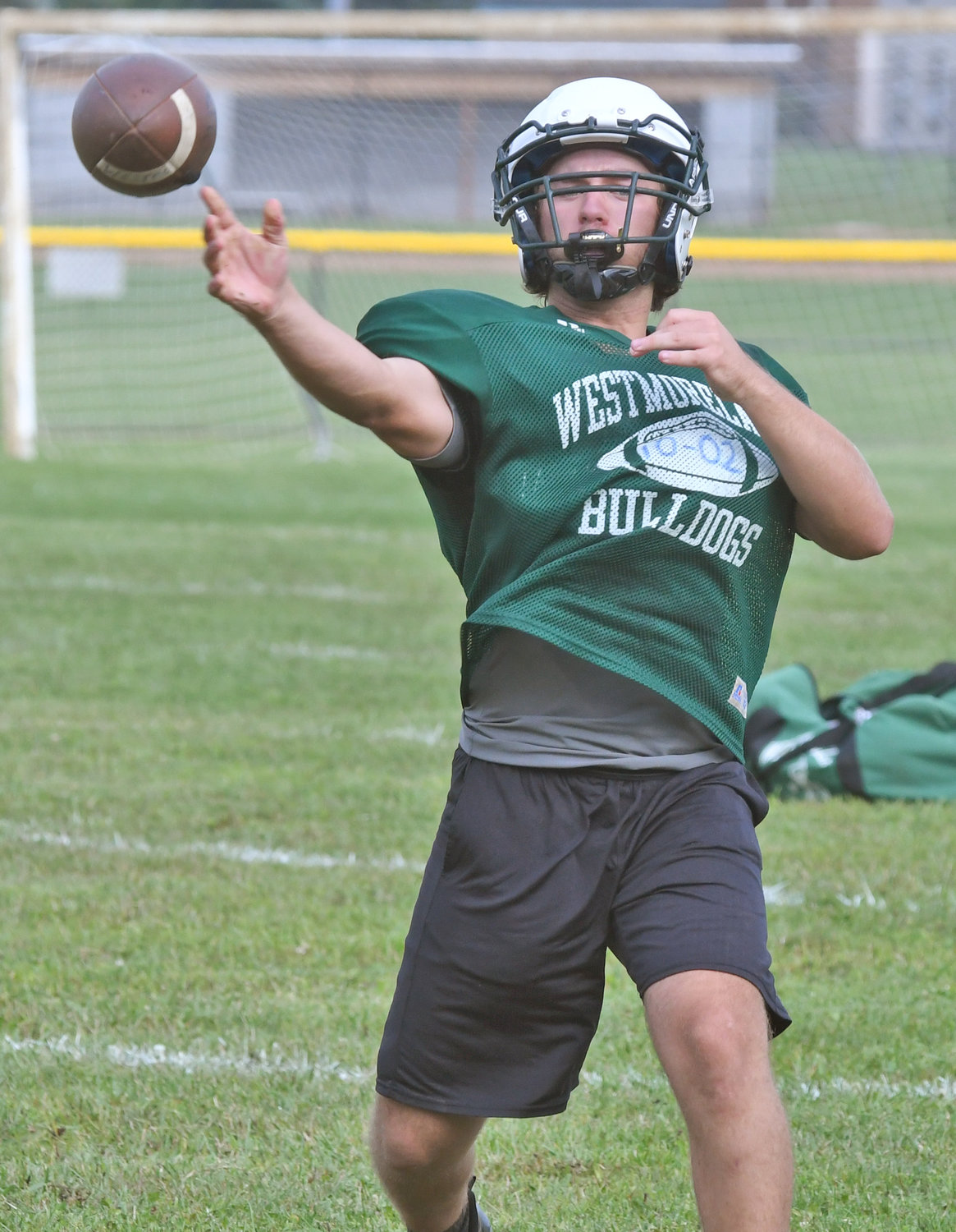 Bulldogs senior quarterback Mike Scalise, a three-year starter, makes a pass during morning drills on Aug. 25.