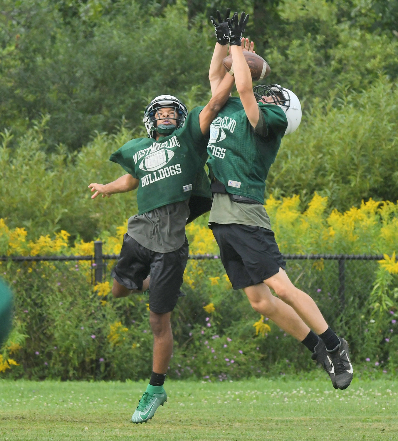 Westmoreland/Oriskany junior defensive back Javante Brill-Rollins breaks up a pass to wide receiver Jack Williams during morning drills on Aug. 25.