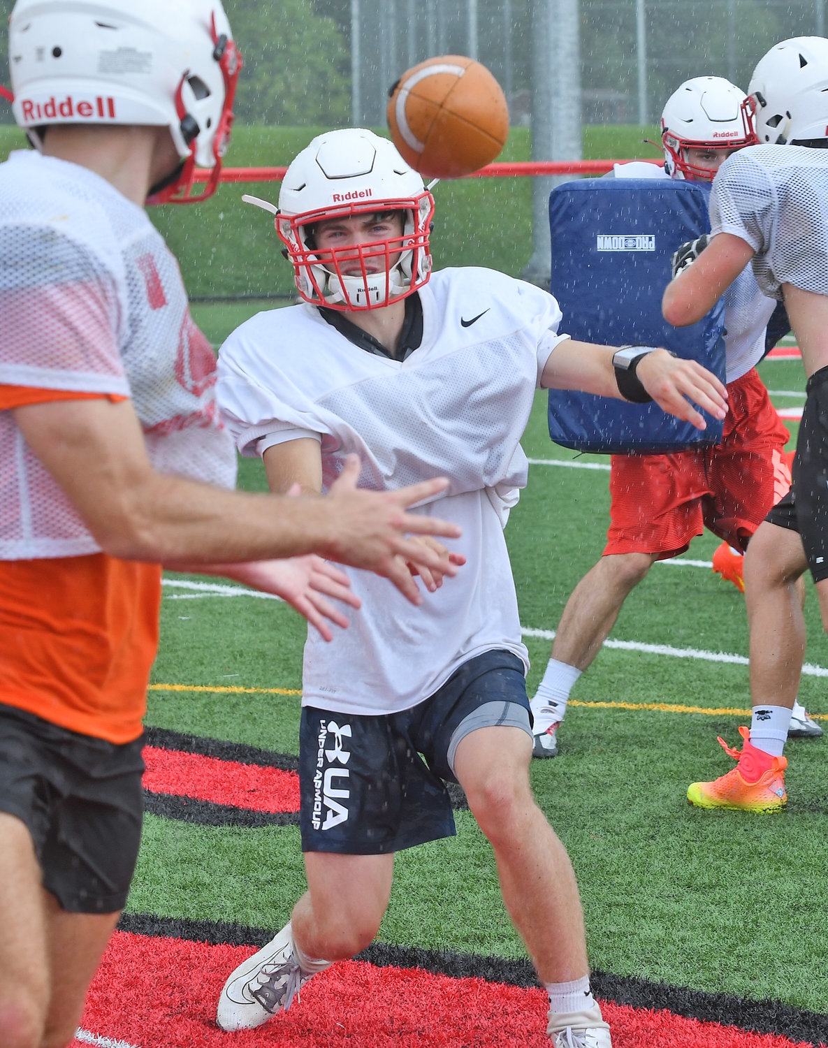 Senior Tyler Shantal makes a toss to an running back during practice. Shantal has a chance to claim the starting quarterback spot for Vernon-Verona-Sherrill. The Red Devils enter the season looking to replace a host of contributors on offense and defense.