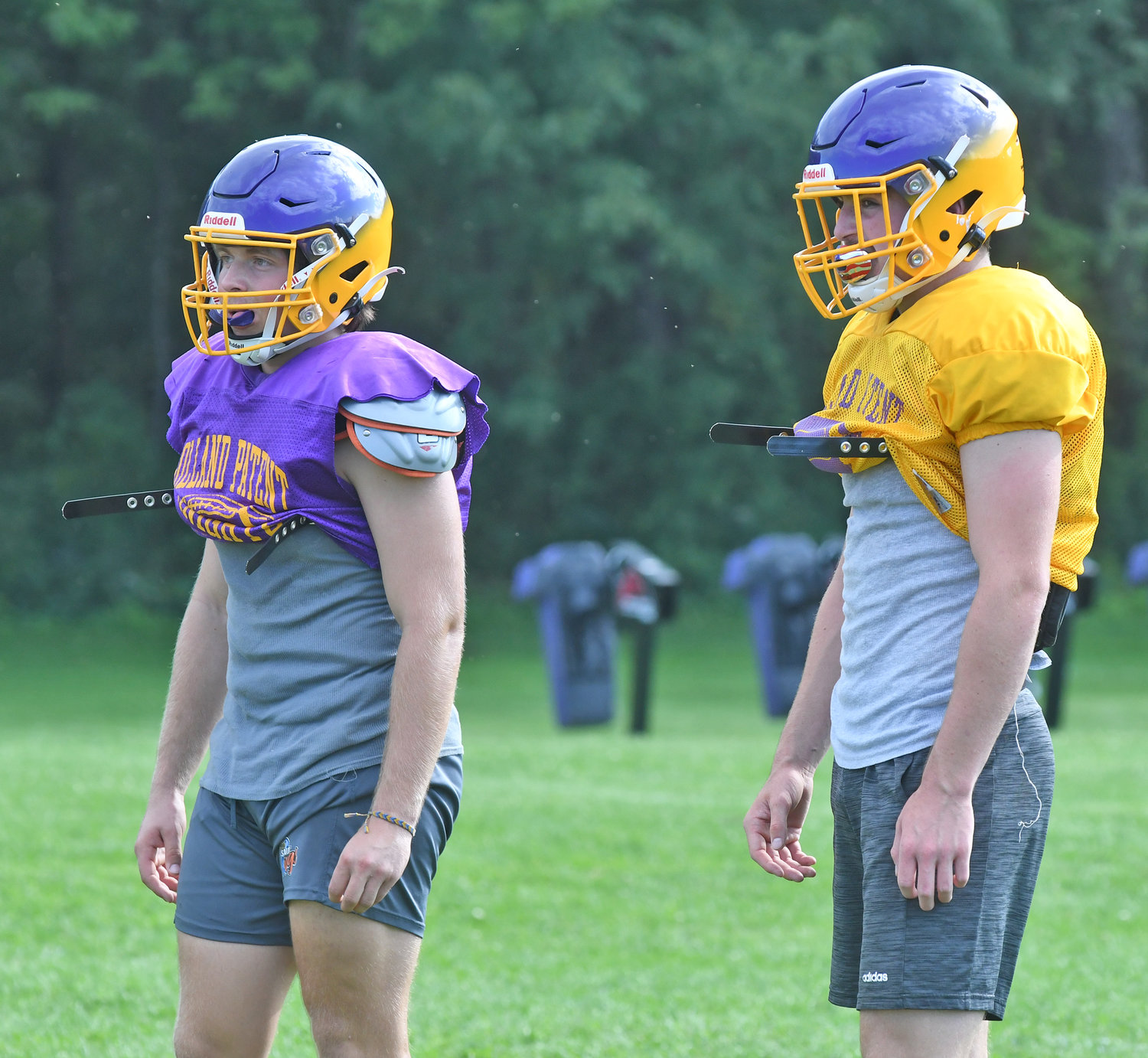 Holland Patent senior quarterback-inside linebacker John Zylynski, left, and senior running back-inside linebacker Jordan Koenig watch the end of a successful passing play during a preseason practice at the high school. The two four-year starters will be important to the Golden Knights’ attempt to win their first Section III Class C title since 2018.