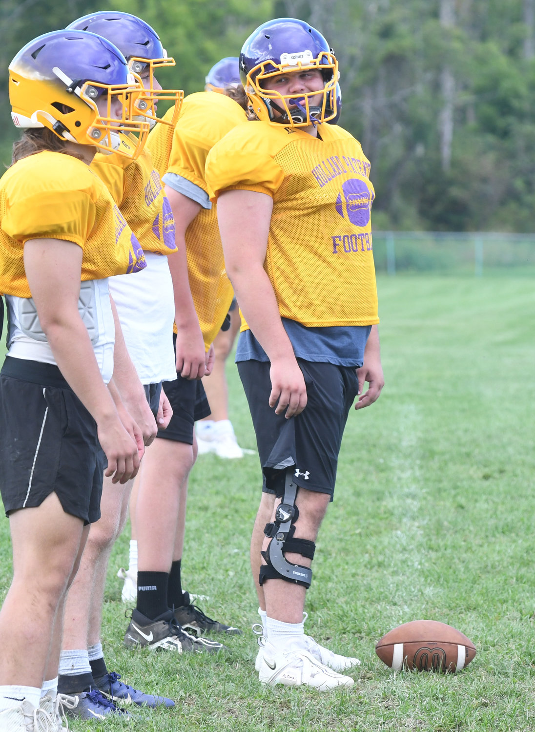 Holland Patent center Alex McLaughlin looks back at the rest of the offensive line before a play starts during practice at the high school in preseason. McLaughlin is one of 18 seniors on the team that boasts a roster of 44.