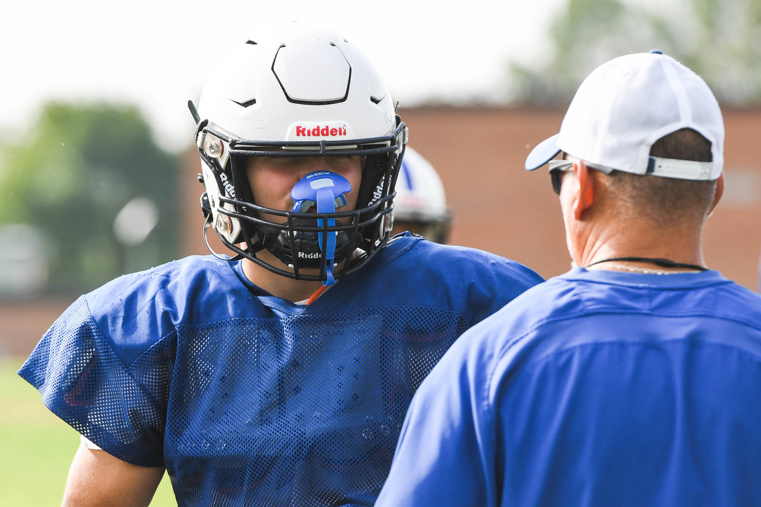 Dolgeville running back Jared Bilinski talks with head coach Daniel Zilkowski before running plays during a morning practice on Aug. 25.