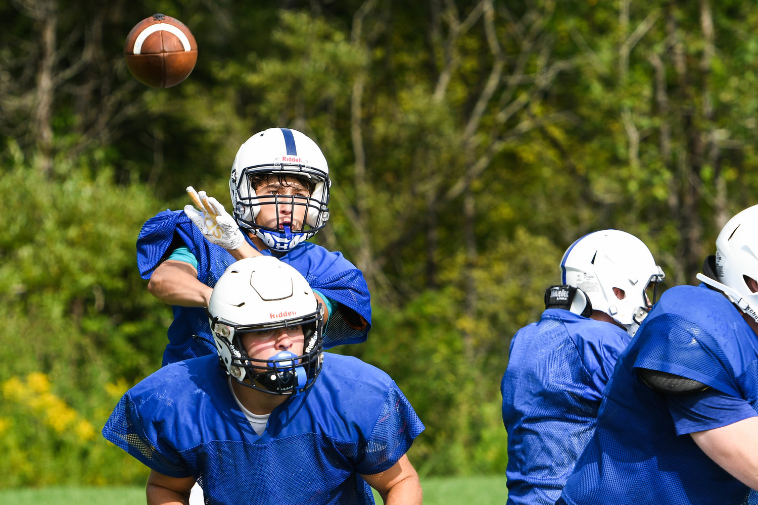 Dolgeville quarterback Cade Mosher throws a pass during a morning practice on Aug. 25.