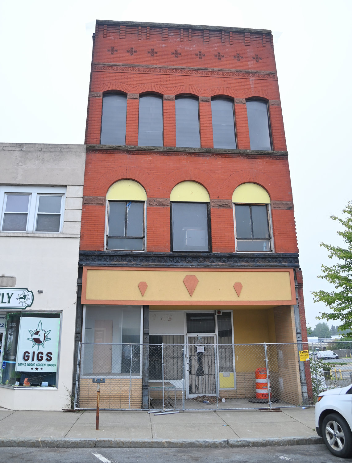 The 233 West Dominick Street building with the mural on the side is pictured on Friday.