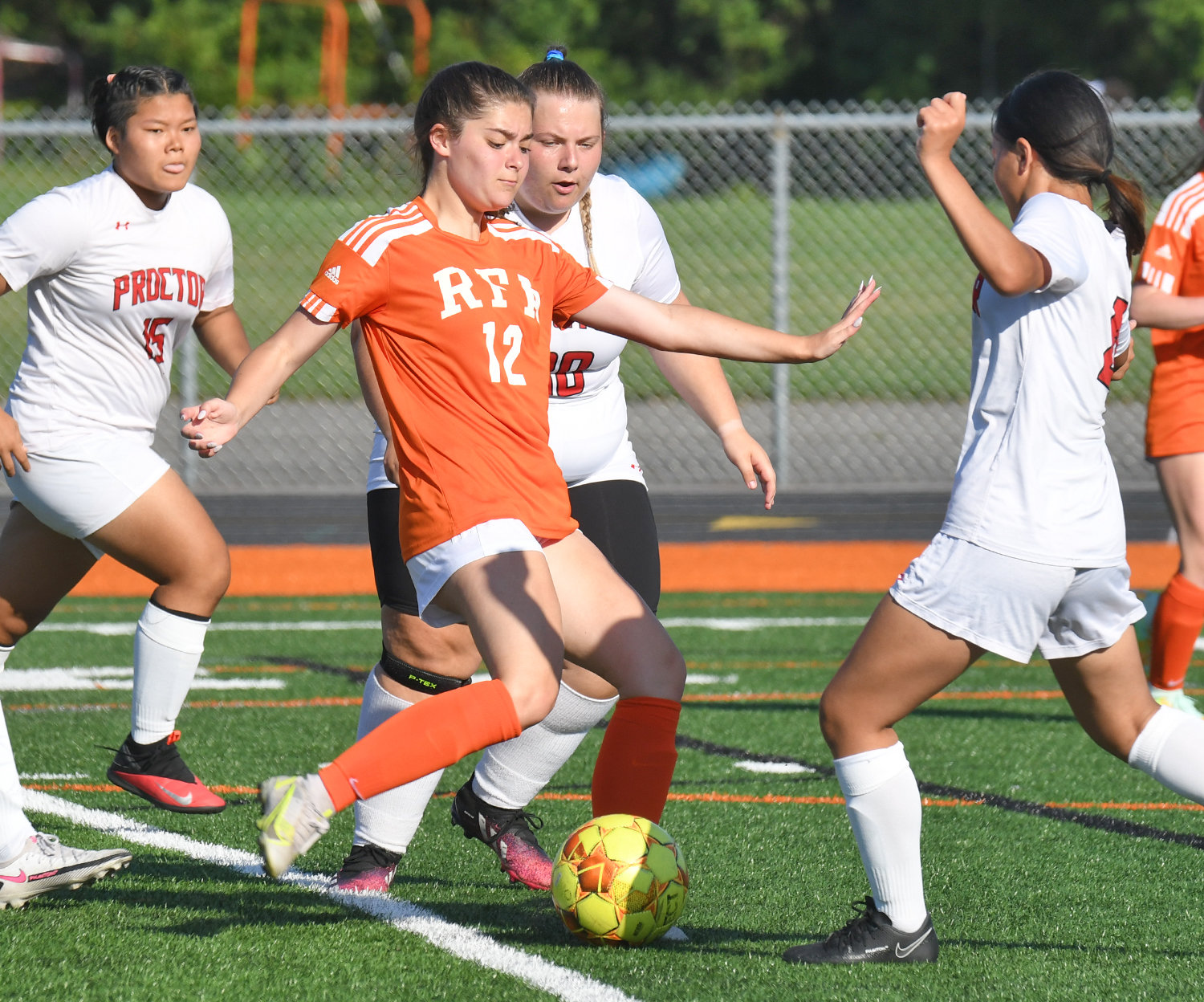 Brooke Frawley unleashes a shot to score the second goal for Rome Free Academy against Utica Proctor Thursday at home. Surrounding her, from left, are Hser Eh Ler Paw, Nadina Gacic and Kimani Thomas. Frawley also had an assist in the team’s 10-0 win.