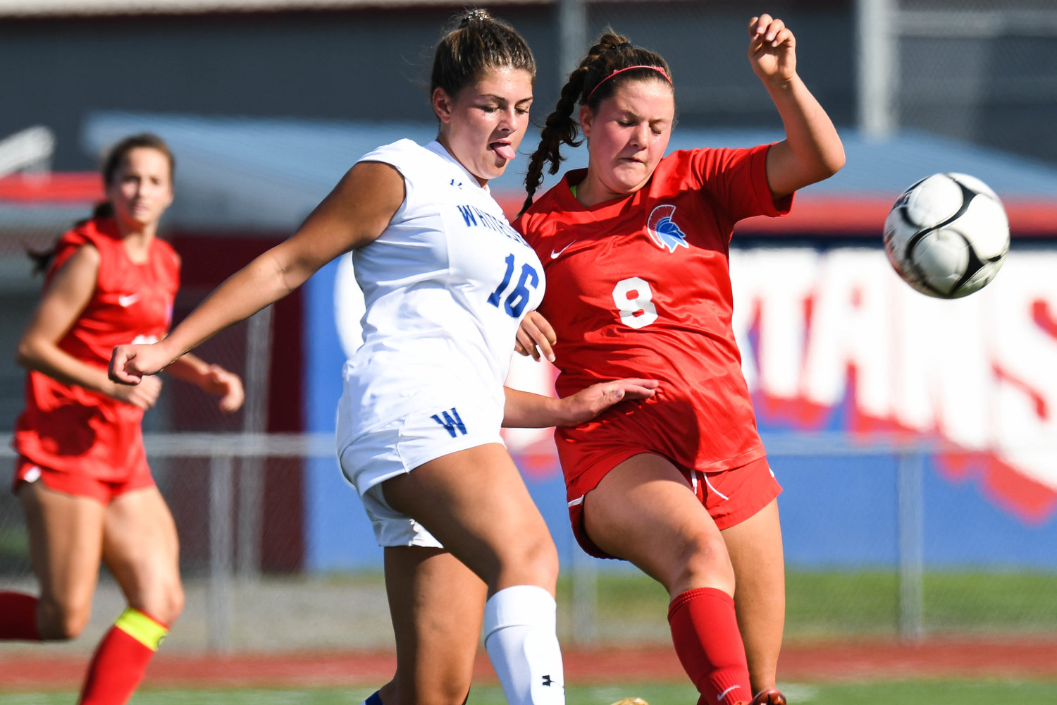 Whitesboro player Morgan Angus, left, fights for control of the ball against New Hartford's Mia Roberts during the game on Thursday. New Hartford won 5-0.