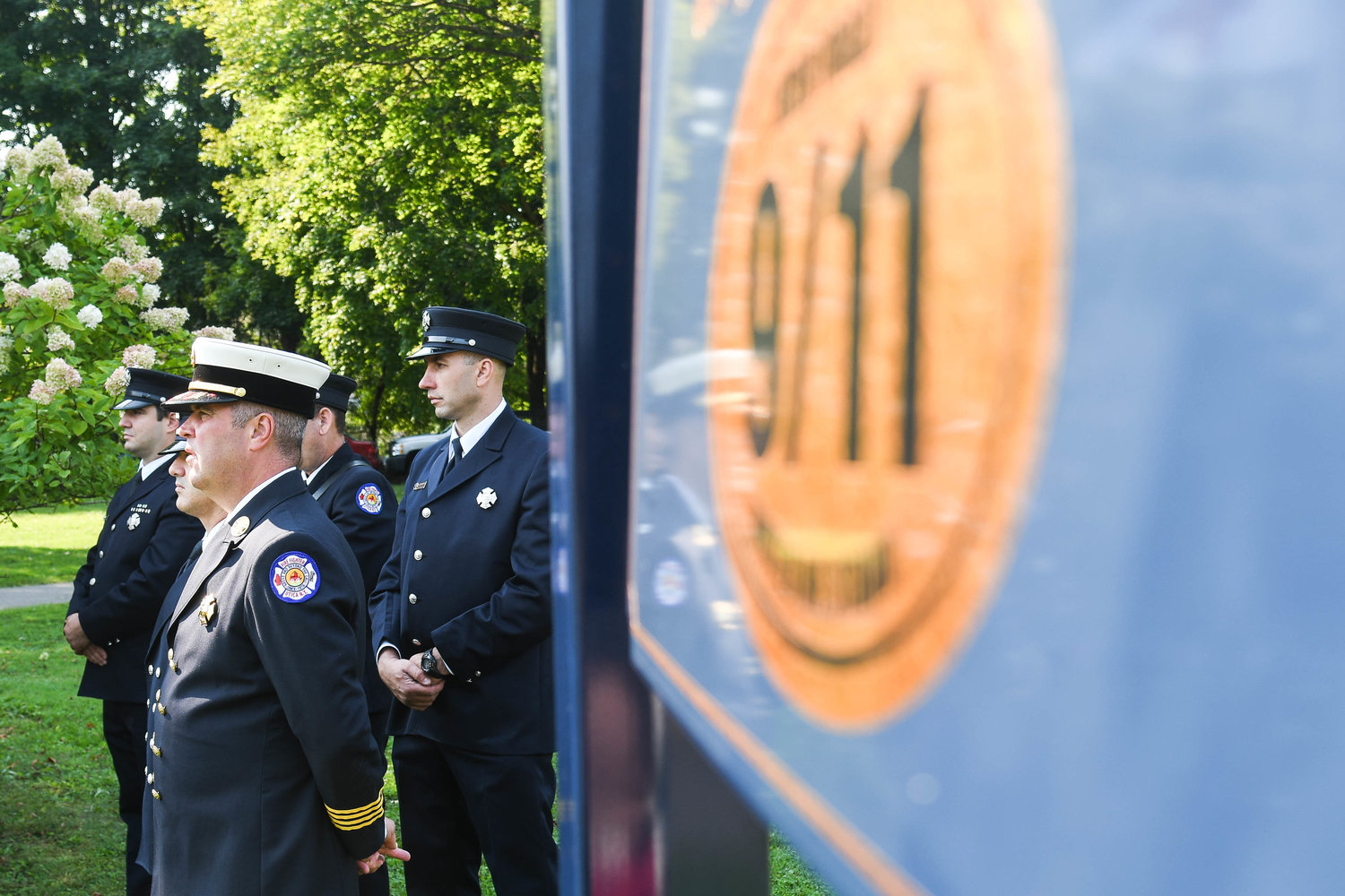 Utica firefighters attend the annual 9/11 Remembrance Ceremony on Friday morning at the 9/11 Memorial in Utica.