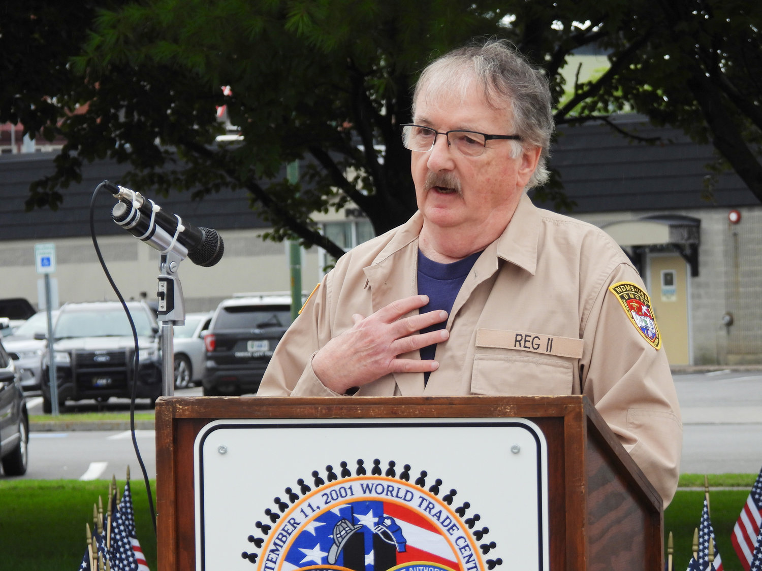 Former Madison County Undersheriff Douglas Bailey speaks at the city of Oneida's 9/11 Remembrance Ceremony on Sunday, recounting his time as a member of the Federal National Disaster Medical System's Disaster Mortuary Response Team during 9/11.