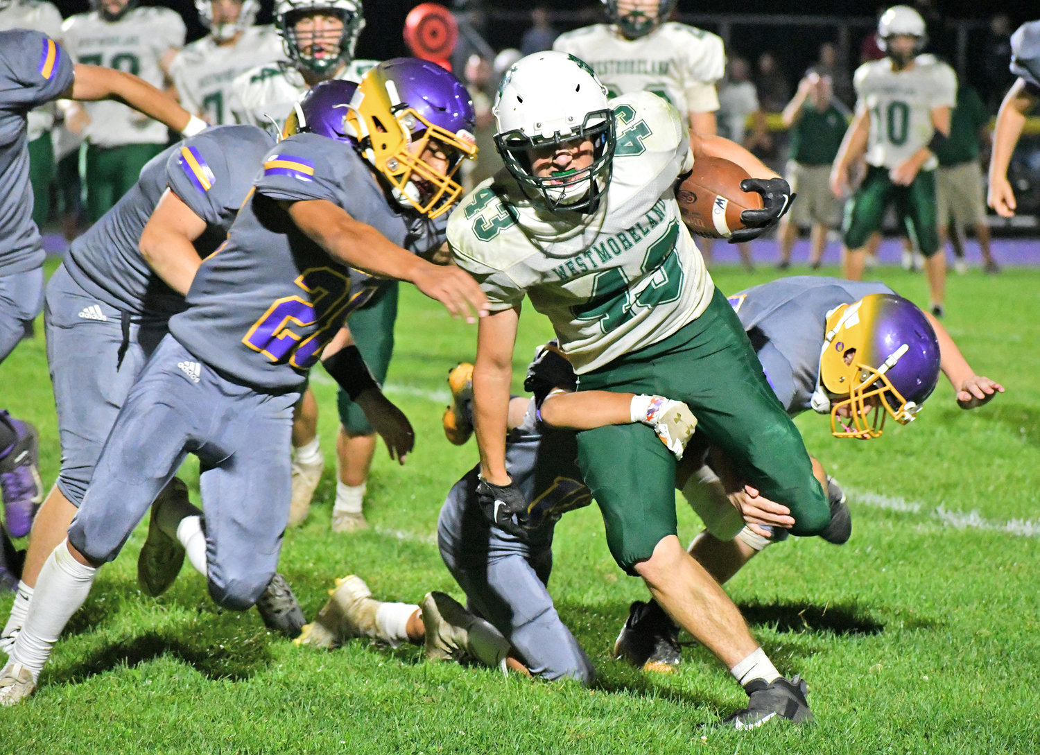 Westmoreland-Oriskany running back Jack Williams is swarmed by Holland Patent defenders in a Class C game Saturday at Holland Patent. Williams scored the Bulldogs’ lone touchdown in a 43-8 loss.
