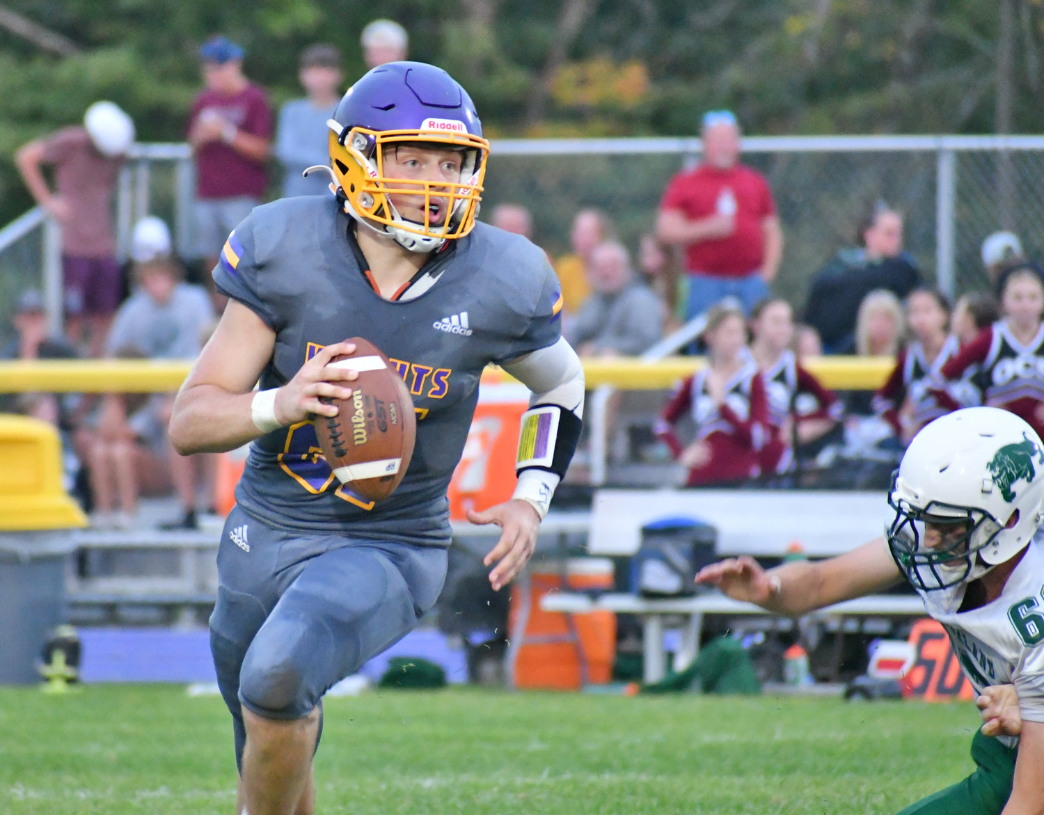 Holland Patent quarterback Jonathan Zylynksi rolls out and looks for an open target against Westmoreland-Oriskany at home Saturday night. The Golden Knights won 43-8.
