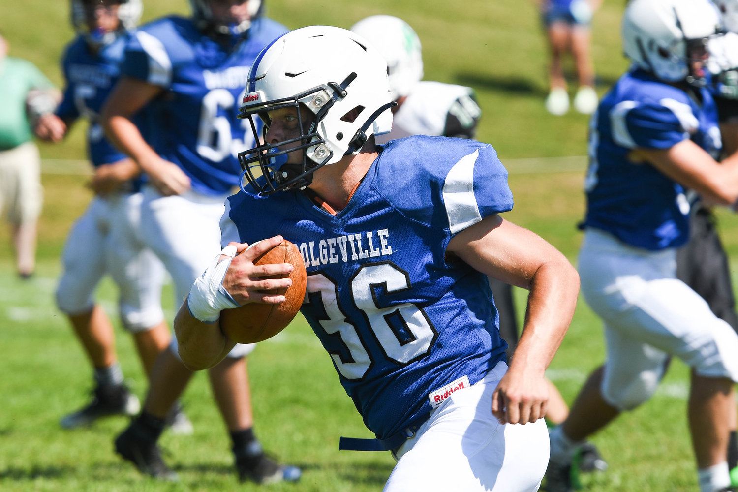 Dolgeville running back Jared Bilinski runs the football during the Class D game against Herkimer on Saturday. The Blue Devils won 68-20.