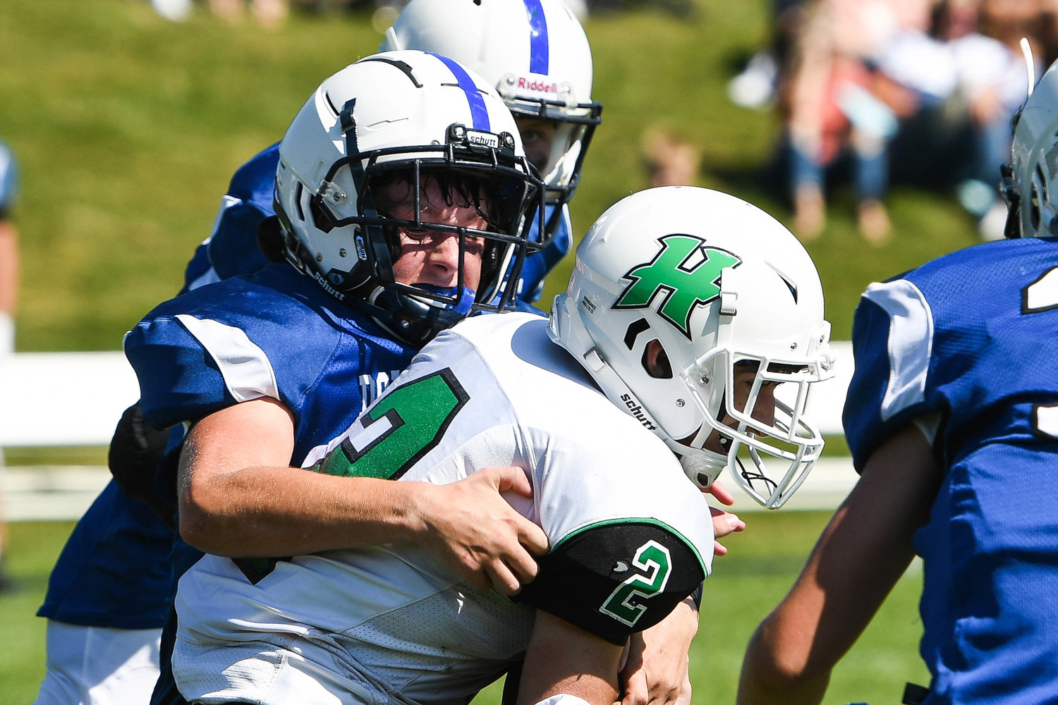 Herkimer running back John Maher (2) is tackled by Dolgeville defender Kolbi Hadden during the Class D game on Saturday. The Blue Devils won 68-20.