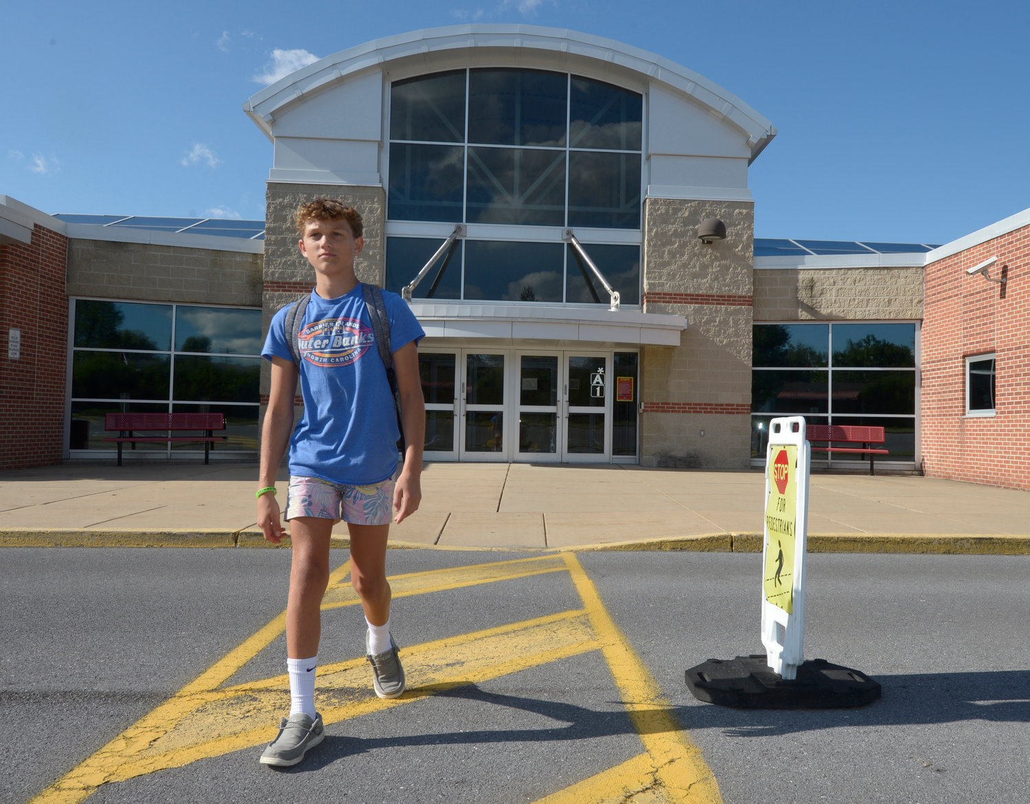 Braylon Price, 13, walks home from Bellefonte Middle School Wednesday, Aug. 31, 2022, in Bellefonte, Pa. The teenager was among more than 45,000 Pennsylvania students whose parents elected to take advantage of a new state pandemic-era law option of holding their child back a year in school. He repeated the sixth grade. (AP Photo/Gary M. Baranec)