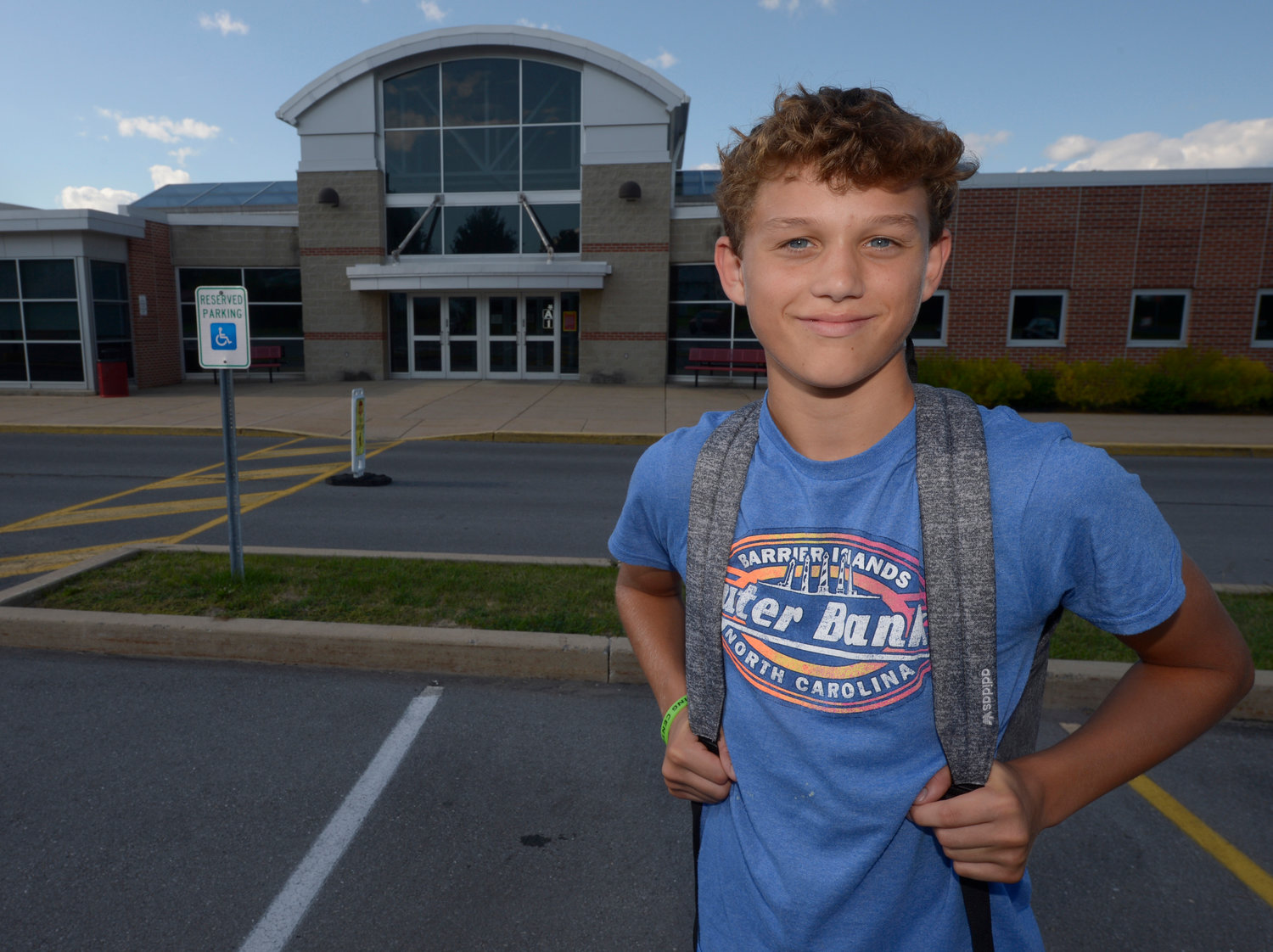 Braylon Price, 13, pauses on his way home from Bellefonte Middle School Wednesday, Aug. 31, 2022, in Bellefonte, Pa. The teenager was among more than 45,000 Pennsylvania students whose parents elected to take advantage of a new state pandemic-era law option of holding their child back a year in school. He repeated the sixth grade. (AP Photo/Gary M. Baranec)