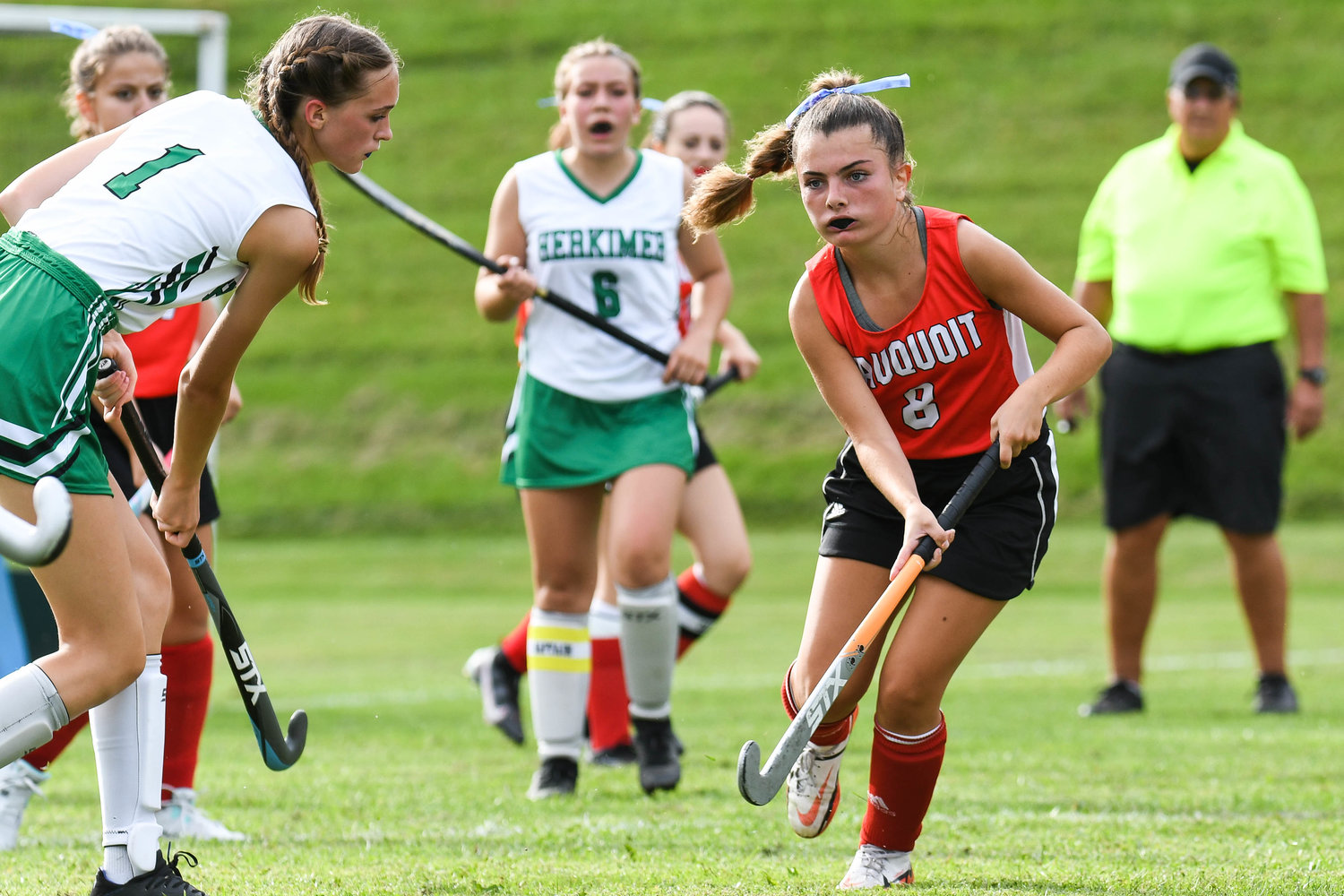 Sauquoit Valley’s Isabella Canarelli (8) moves the ball against Herkimer defender Sydney Bell (1) during the Center State Conference field hockey game on Monday in Herkimer. Sauquoit Valley is 2-1-1 and Herkimer is 0-2-1.
