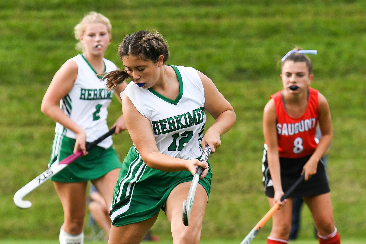Herkimer player Aleah Chabrier (12) attempts to pass the ball during the Center State Conference field hockey game against Sauquoit Valley on Monday in Herkimer. The two teams played to a scoreless tie.