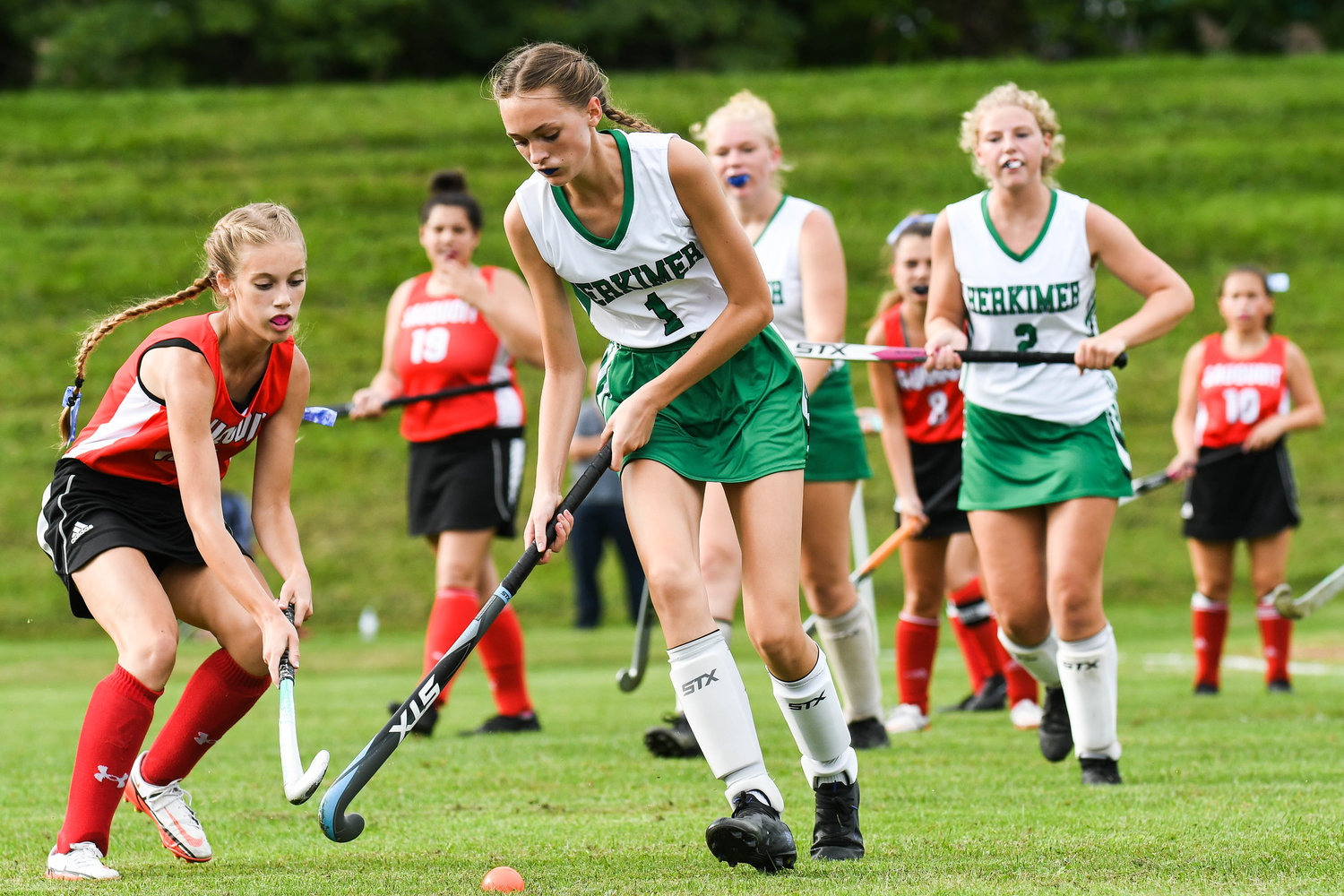 Herkimer player Sydney Bell (1) moves the ball against Sauquoit Valley defender Emilie Fancett during the Center State Conference field hockey game on Monday in Herkimer. The two teams played to a scoreless tie.