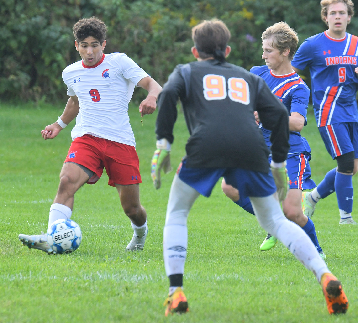 New Hartford’s Aly Radwan looks to center the ball with Oneida goaltender Kannon Curro and Onieda player Cash Kistner looking to stop the play. New Hartford won the Tri-Valley League match on the road Tuesday 6-1. Curro made 14 saves.