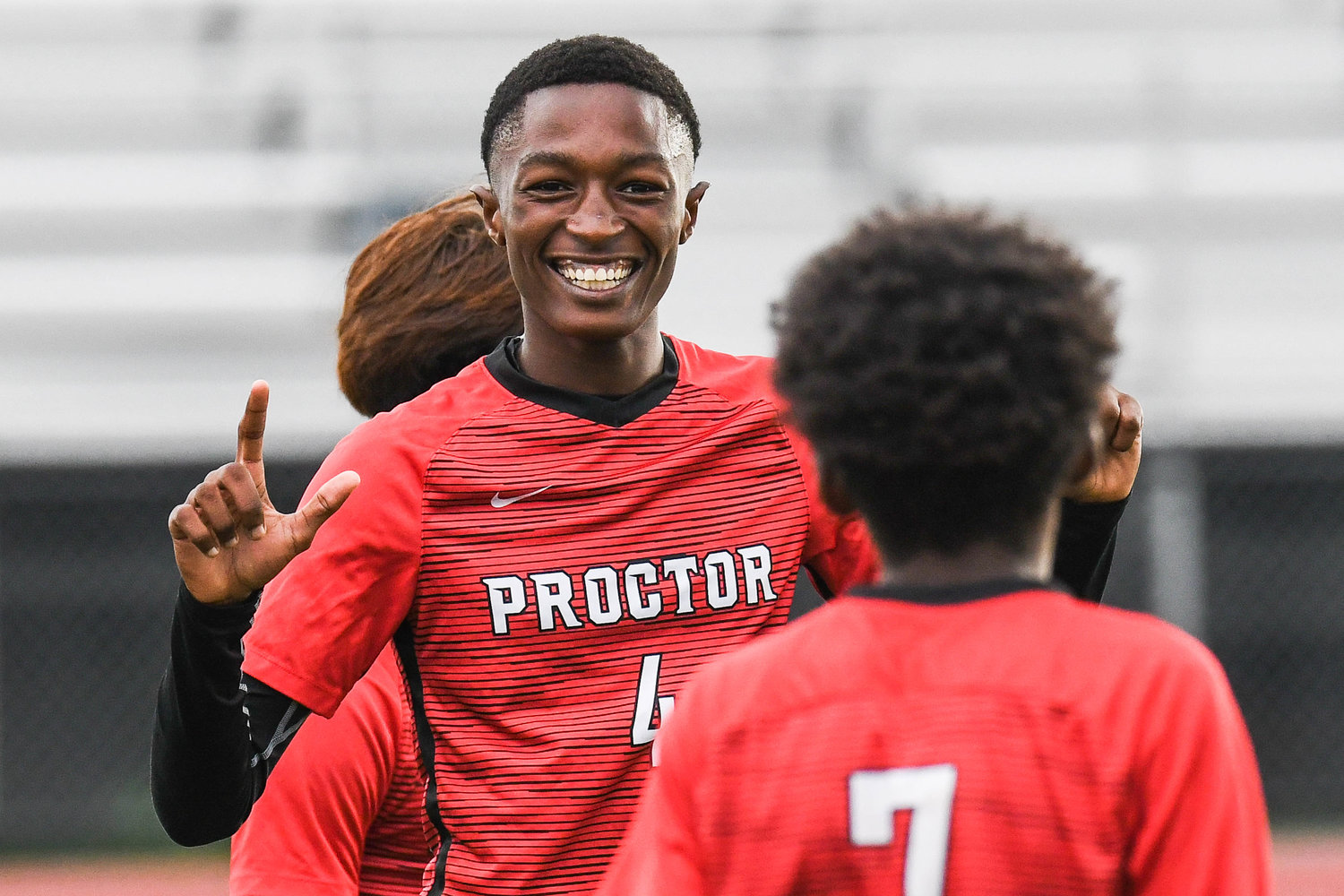 Proctor player Hussein Awo (4) celebrates with teammate Siidahmed Somow (7) after scoring a goal during the soccer game against VVS on Tuesday.