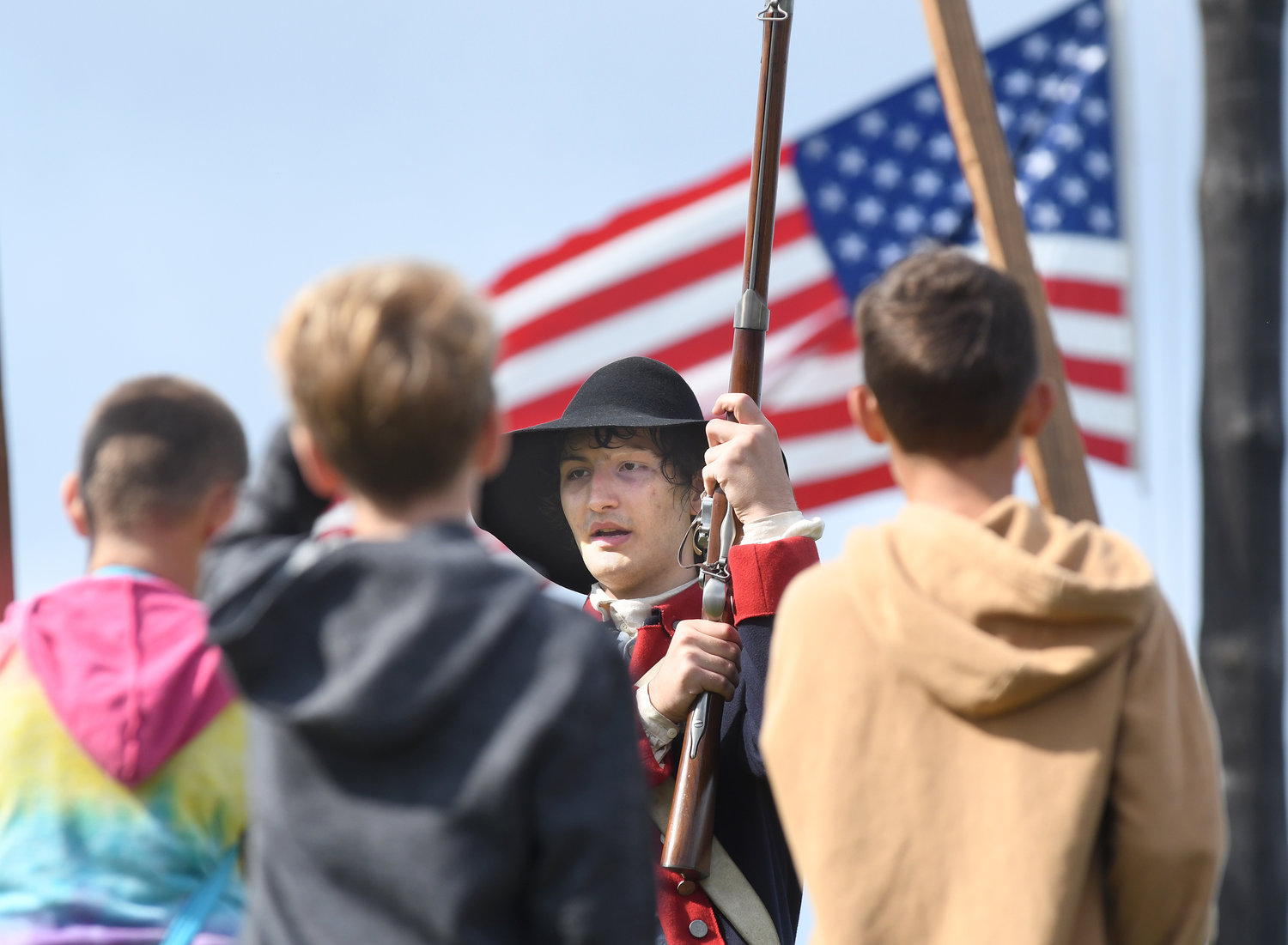 3rd NY Regiment Private Elijah Braun leads a group of home schooled children through a demonstration of the workings of a musket Wednesday at Fort Stanwix in Rome.