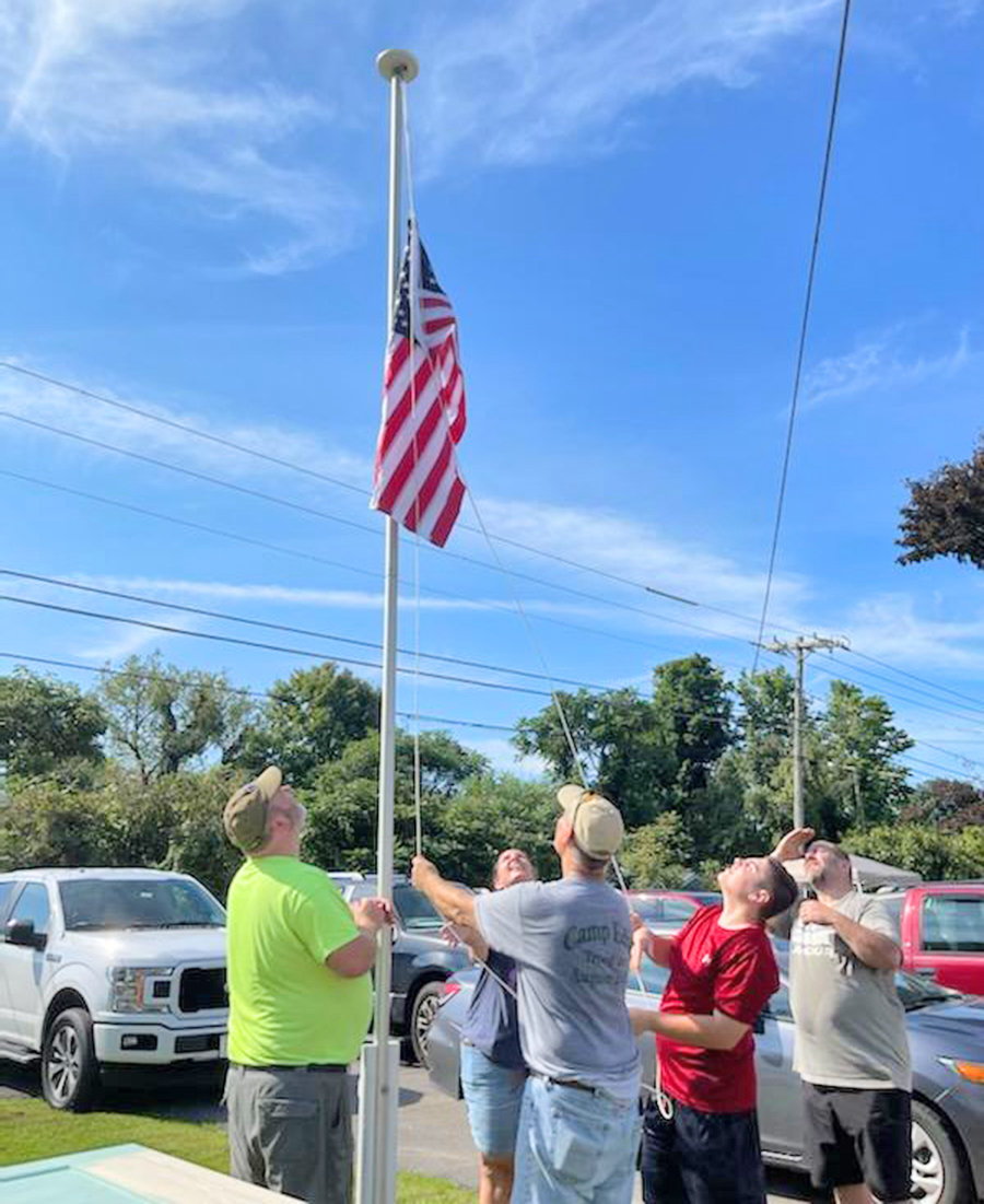 Volunteers replaced the Humane Society of Rome's flag pole with a brand new one equipped with solar lights.