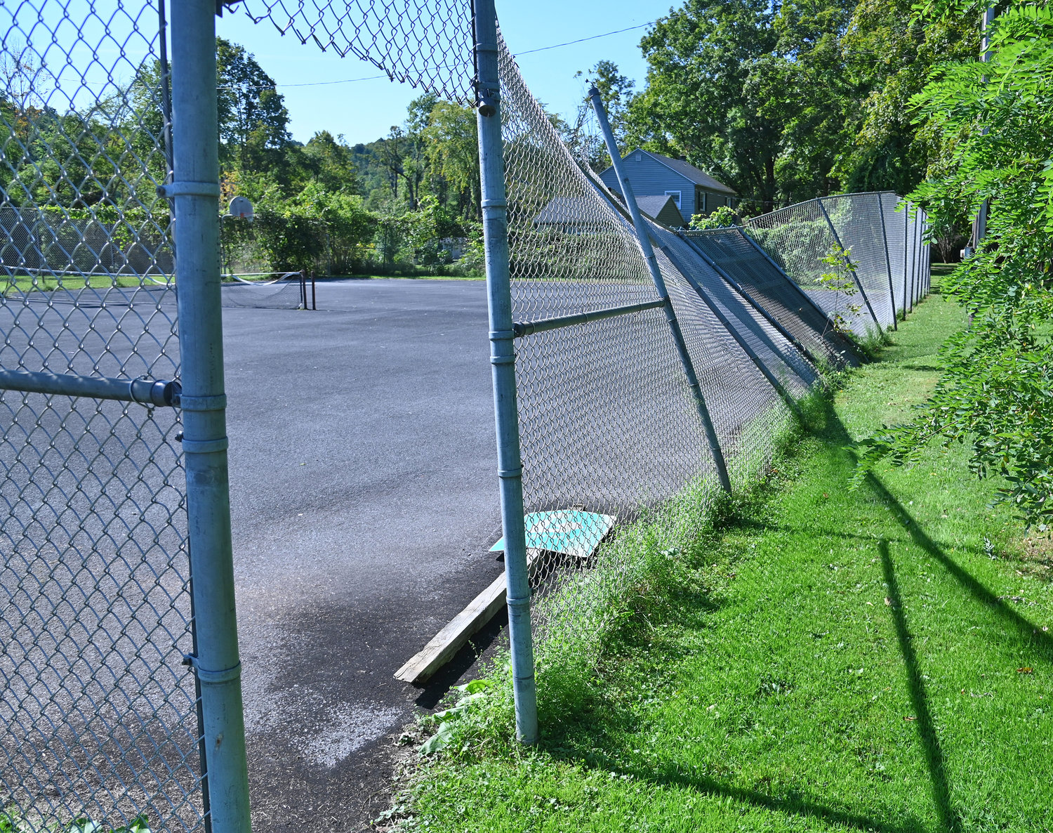 Fence that was damaged during the 2021 tornando in Westernville. The tennis  and basketball courts are next to the Western Town Library.