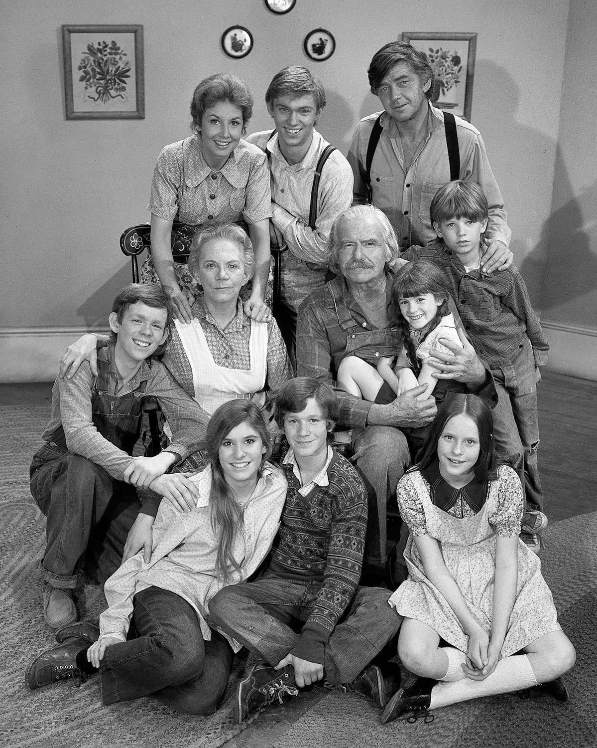 This photo provided by CBS in September 2022 shows actors in the television series “The Waltons.” Bottom row from left are Judy Norton-Taylor, Eric Scott and Mary Elizabeth McDonough. Second row from left are Jon Walmsley, Ellen Corby, Will Geer, Kami Cotler and David W. Harper. Top row from left are Michael Learned, Richard Thomas and Ralph Waite.