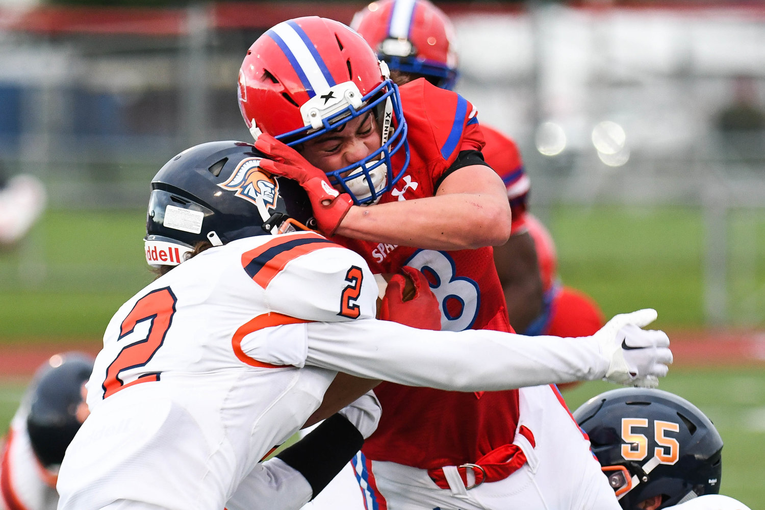 New Hartford senior Alex Collver (8) collides with East Syracuse-Minoa's Damon Jones (2) Friday at Don Edick Field. Collver had more than 200 yards rushing and two touchdowns for New Hartford.