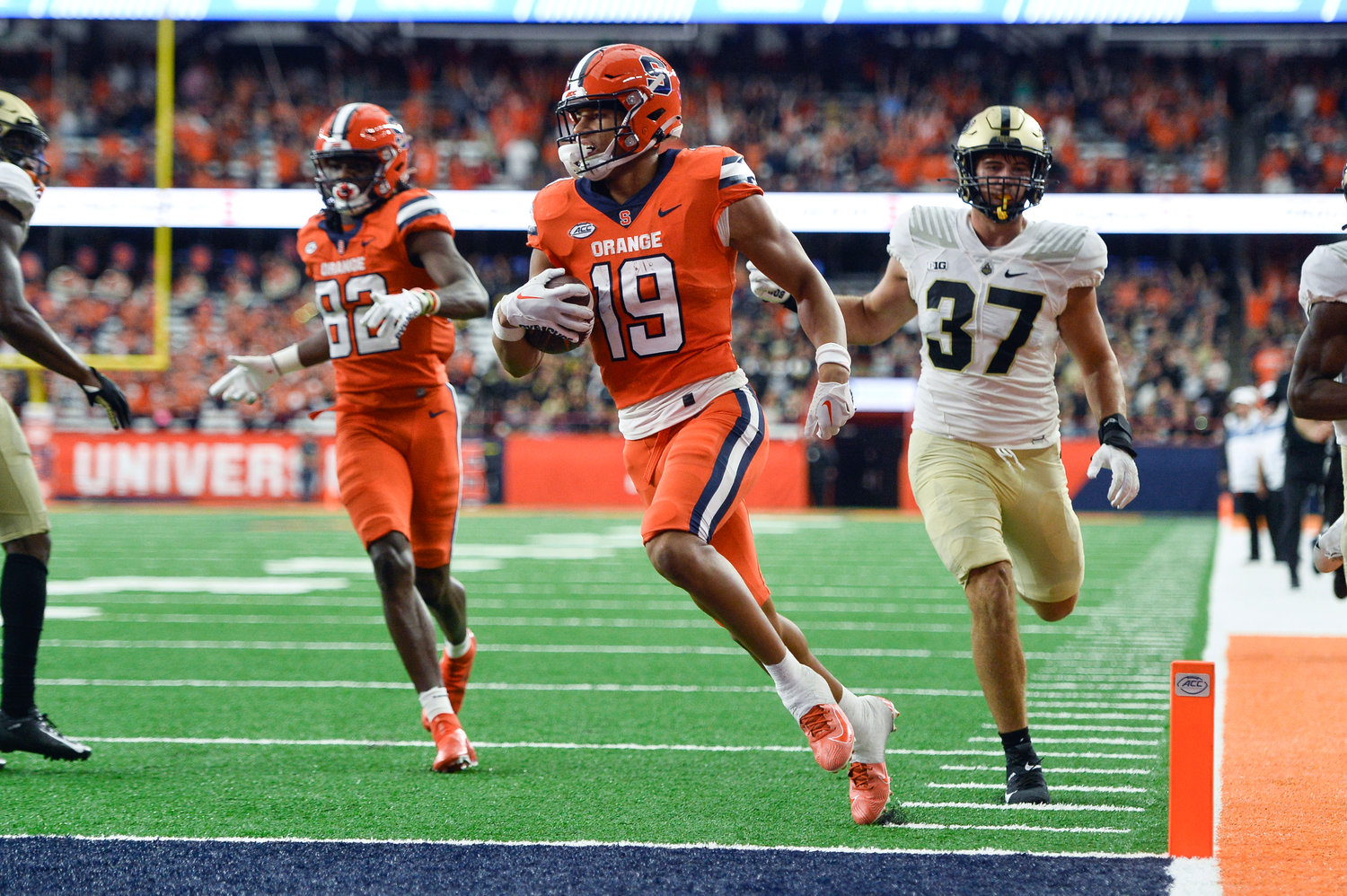 Syracuse wide receiver Oronde Gadsden II, center, scores a touchdown against Purdue during the second half of an NCAA college football game in Syracuse, N.Y., Saturday, Sept. 17, 2022. Syracuse won 32-29.