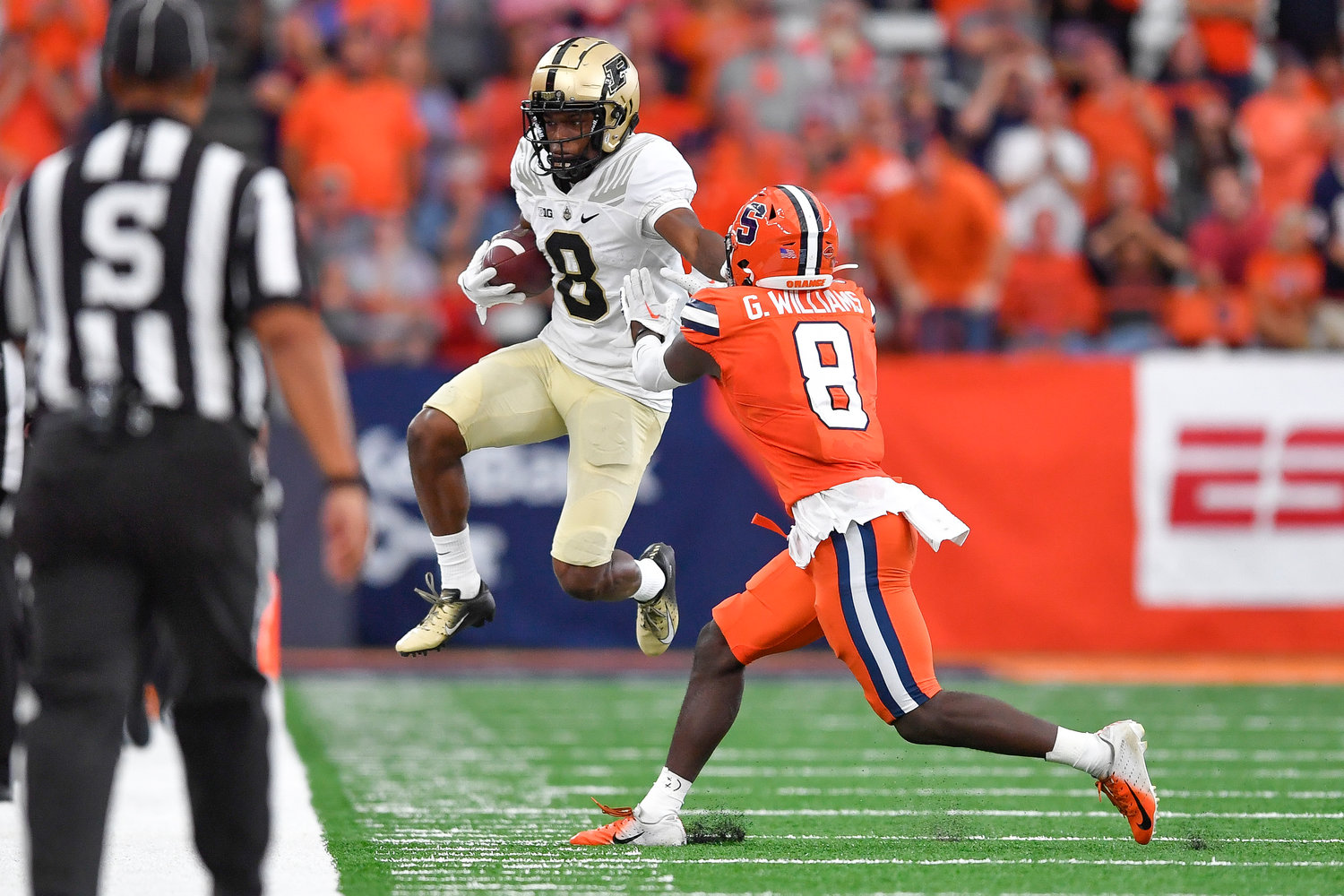 Purdue wide receiver TJ Sheffield, left, jumps out of bounds after a catch against Syracuse defensive back Garrett Williams during the second half of an NCAA college football game in Syracuse, N.Y., Saturday, Sept. 17, 2022.