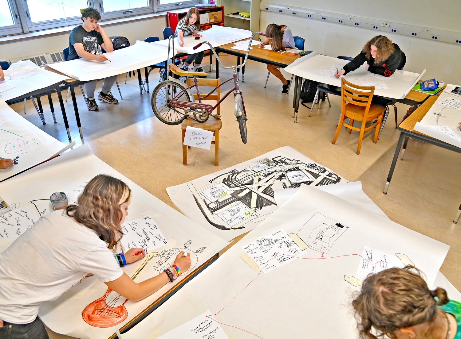 New Hartford students work on their drawings Monday in art class.