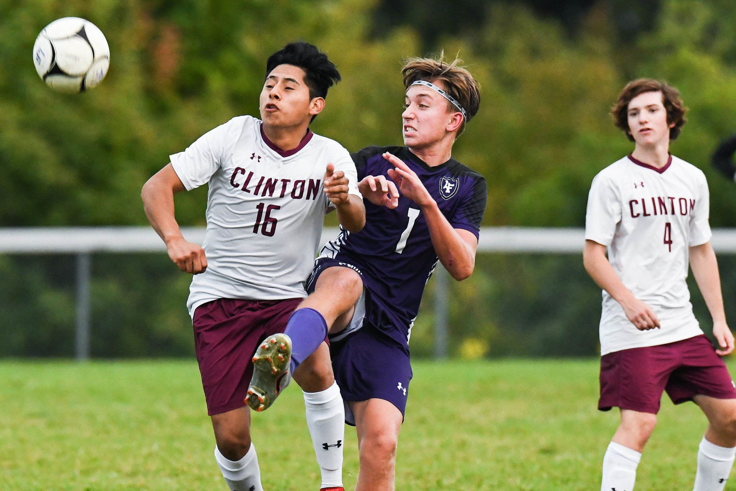 Clinton player Jimi Alvarez (16) fights for control of the ball with Little Falls player Jack Morotti (1) during the game on Tuesday. Morotti scored twice to power the Mounties to a 3-1 win at home.