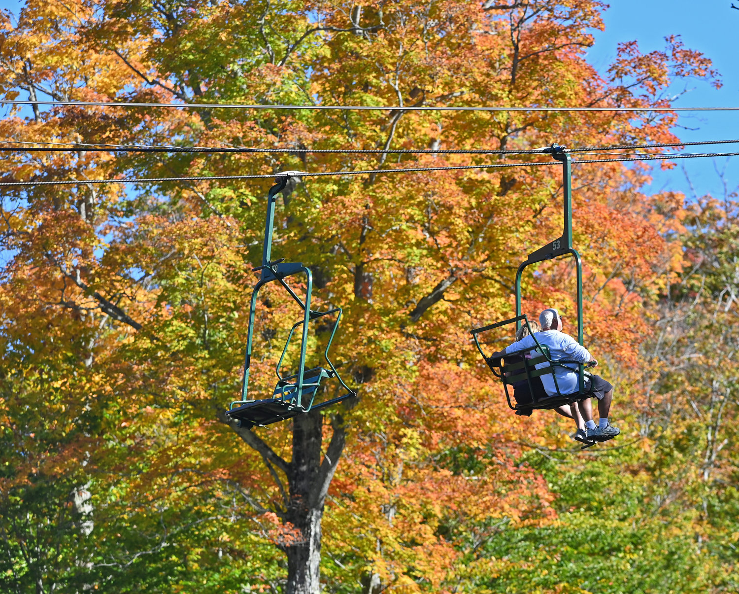 The scenic ski lift at McCauley Mountain with foliage that is almost at peak on Oct. 7, 2021.