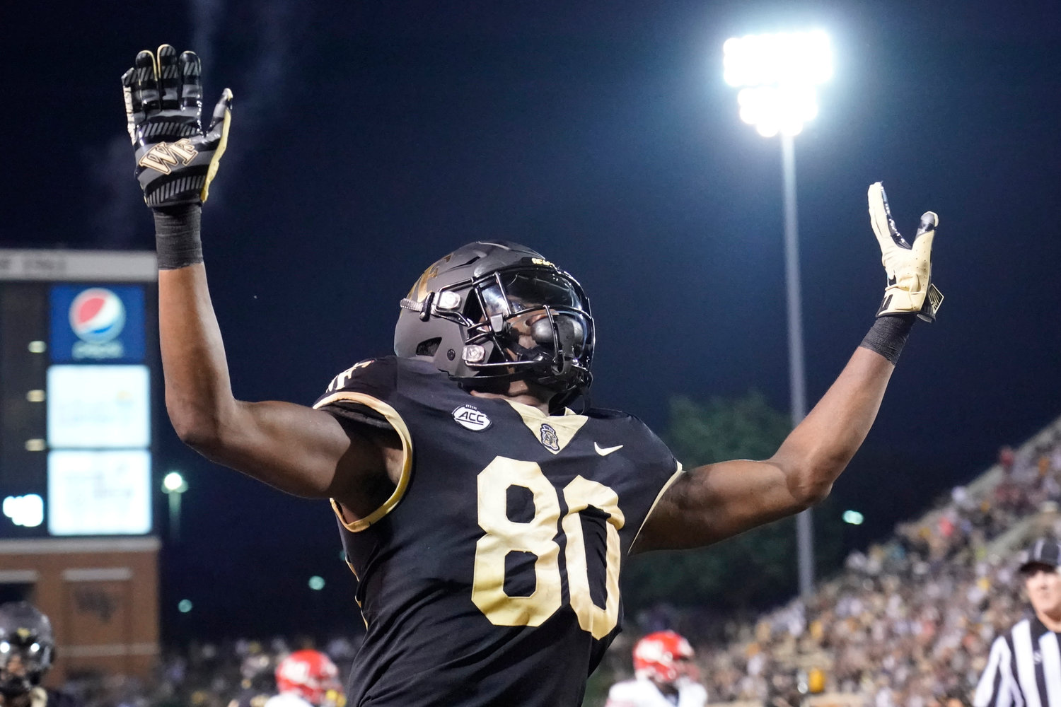 Wake Forest wide receiver Jahmal Banks (80) celebrates after catching a touchdown pass against Liberty during the second half of an NCAA college football game in Winston-Salem, N.C., Saturday, Sept. 17, 2022. (AP Photo/Chuck Burton)