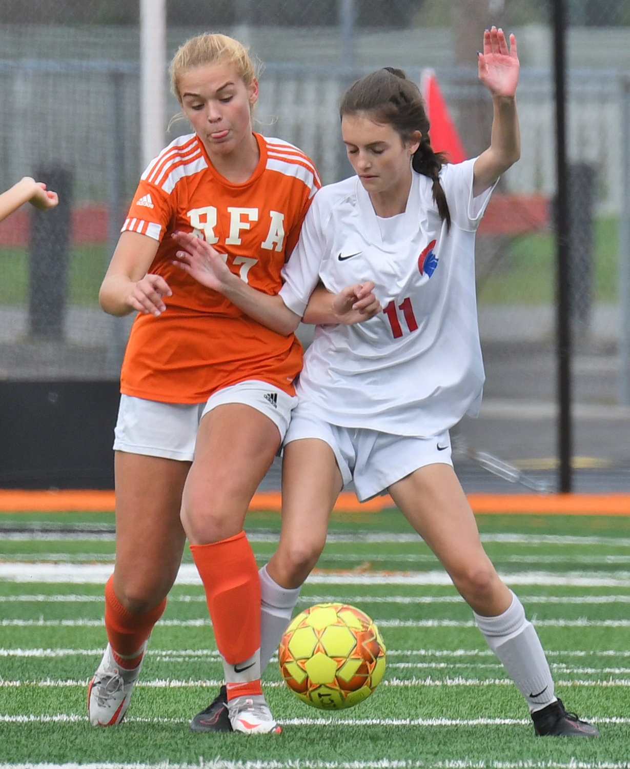 Rome Free Academy's Amelia Furbeck and New Hartford's Kacey Richards fight for the ball during the first half Thursday at RFA Stadium. New Hartford earned the win and improved to 8-0-1 this season. RFA is 5-4 overall.